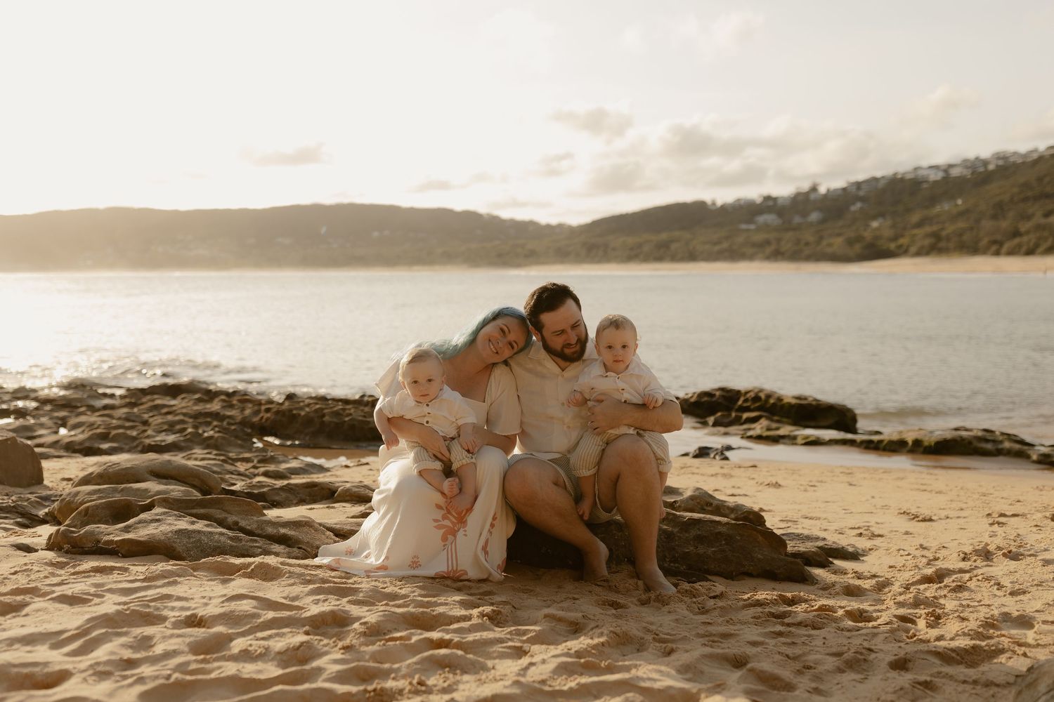 A series of romantic beach photos at sunset with people sitting together on coastal rocks and sand.