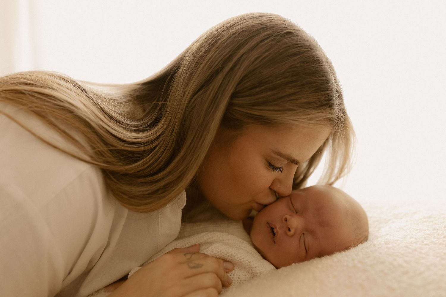A collection of images showing tender moments of someone sleeping peacefully in bed.