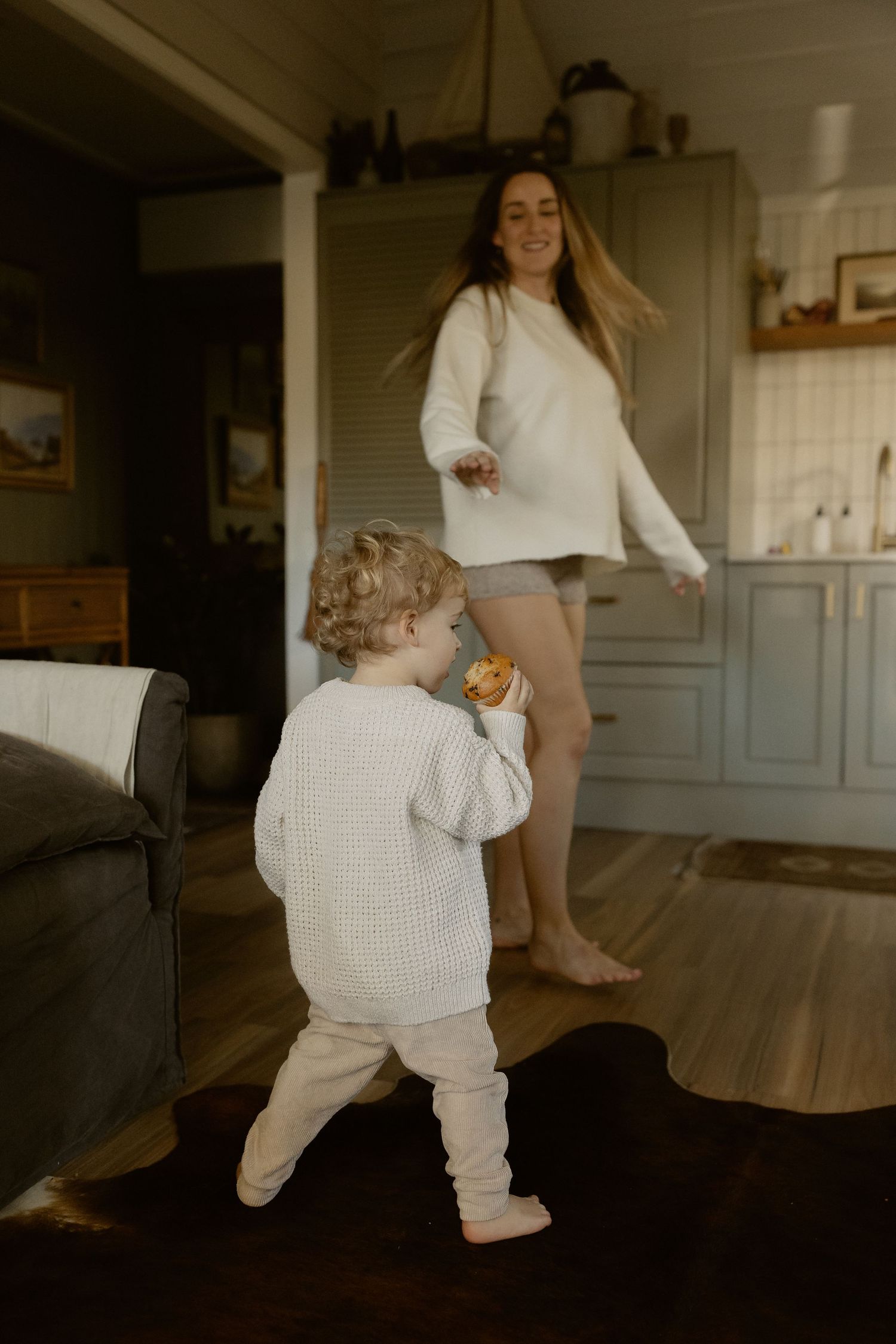 Dancing and movement sequence captured in a sunlit home interior.