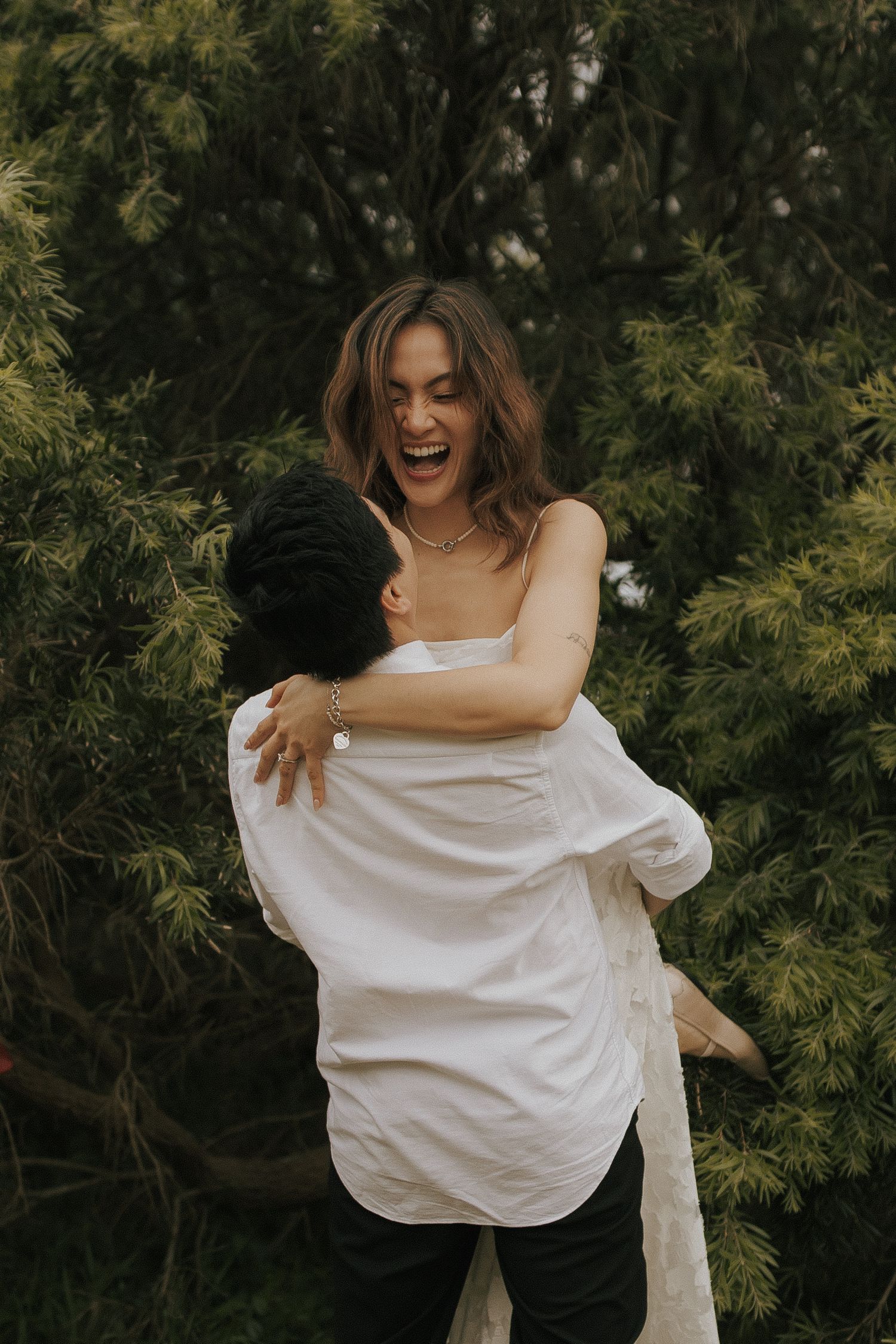 A joyful moment captured in a series of expressive portraits against a natural green foliage background.