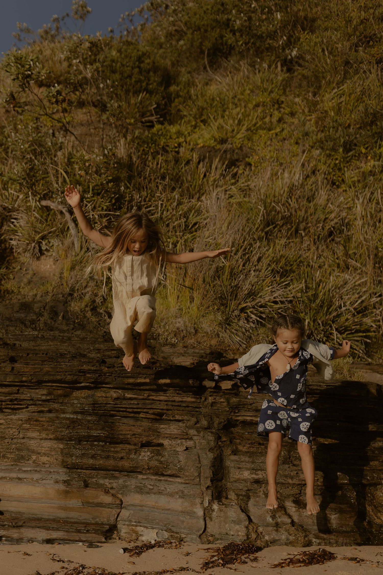 Sequence of action shots showing a person jumping and playing on wooden beams at sunset.