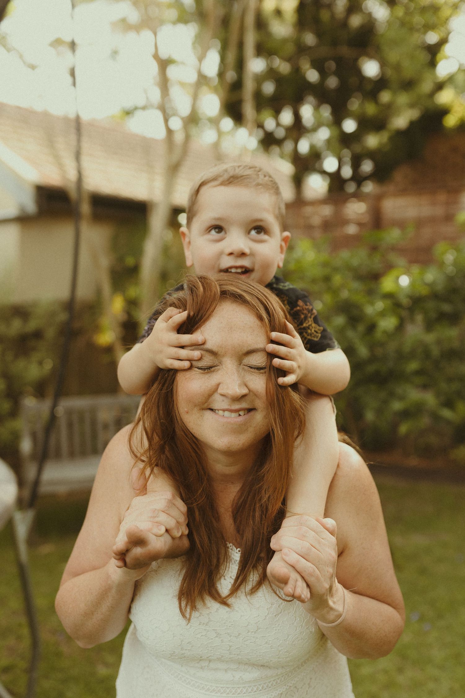 Playful sequence of peek-a-boo moments captured in a sunny backyard.