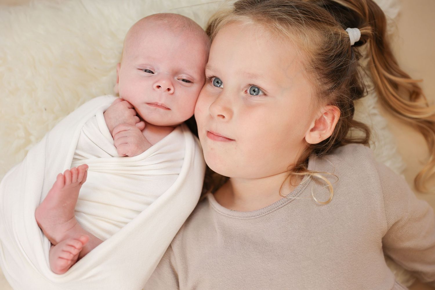 A collection of intimate newborn portraits showing precious moments between parent and baby in soft, gentle lighting.