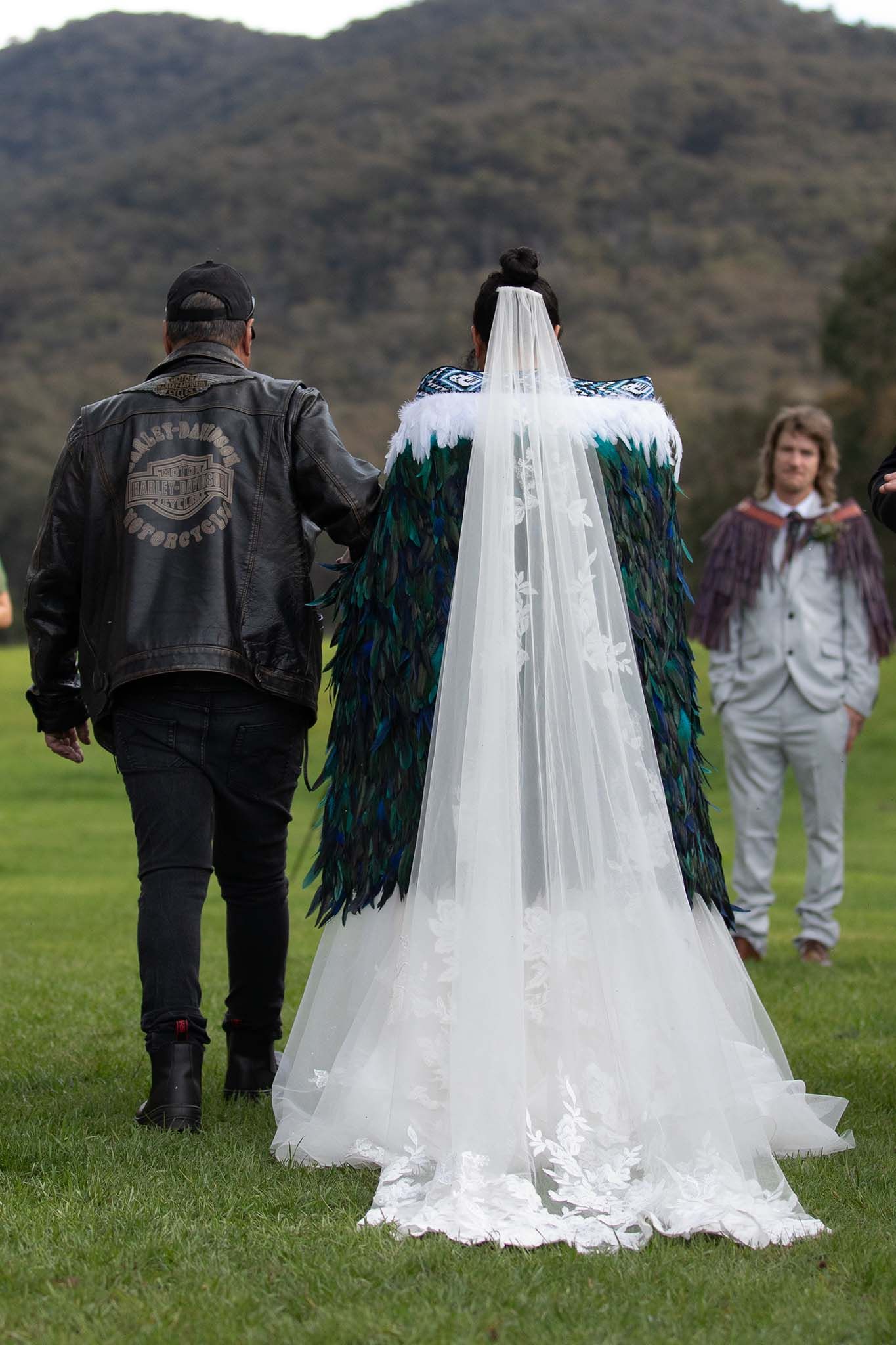 Bride wearing a handmade huruhuru korowai at her Lima East wedding