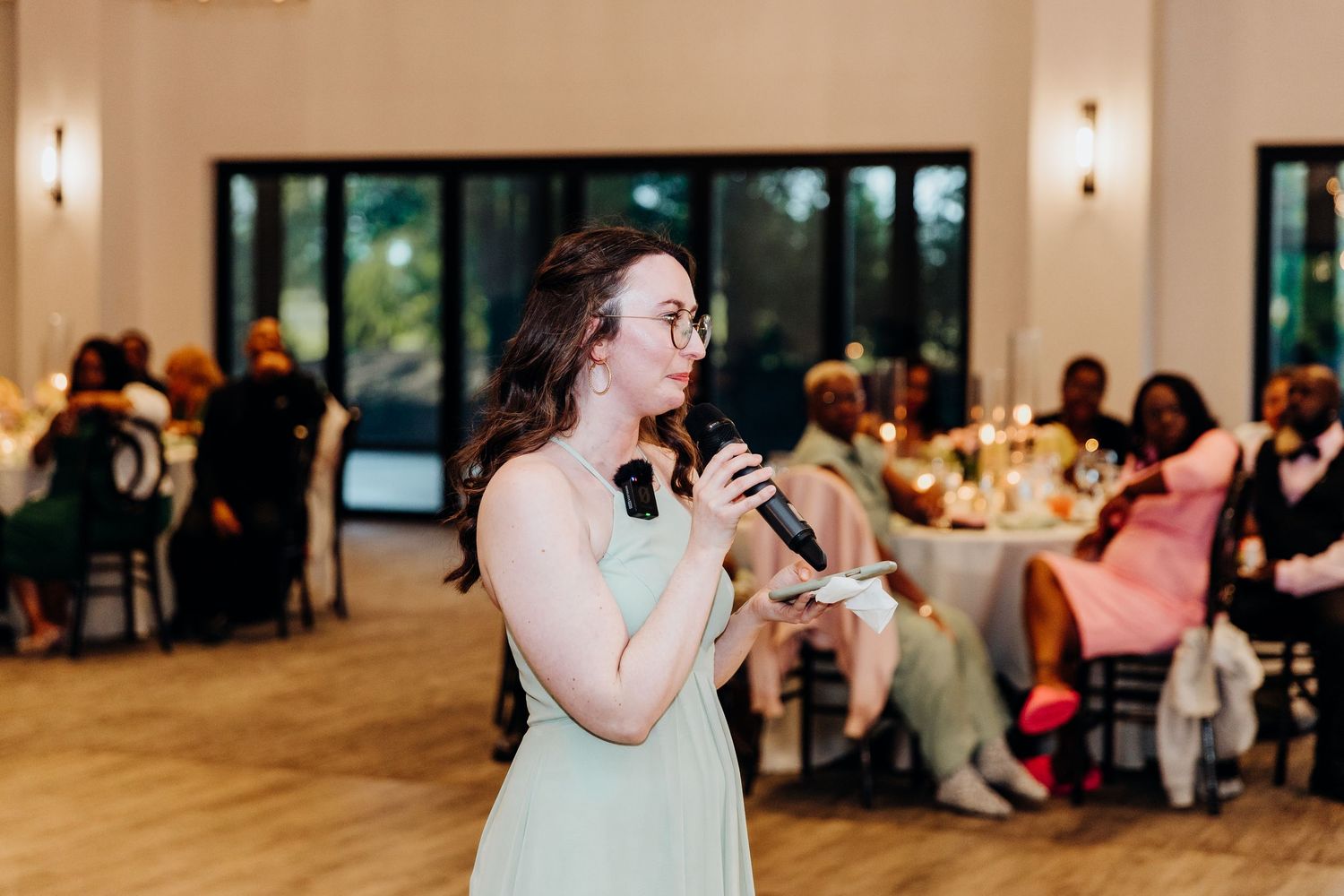 Indoor wedding reception venue with warm lighting and elegant decor.