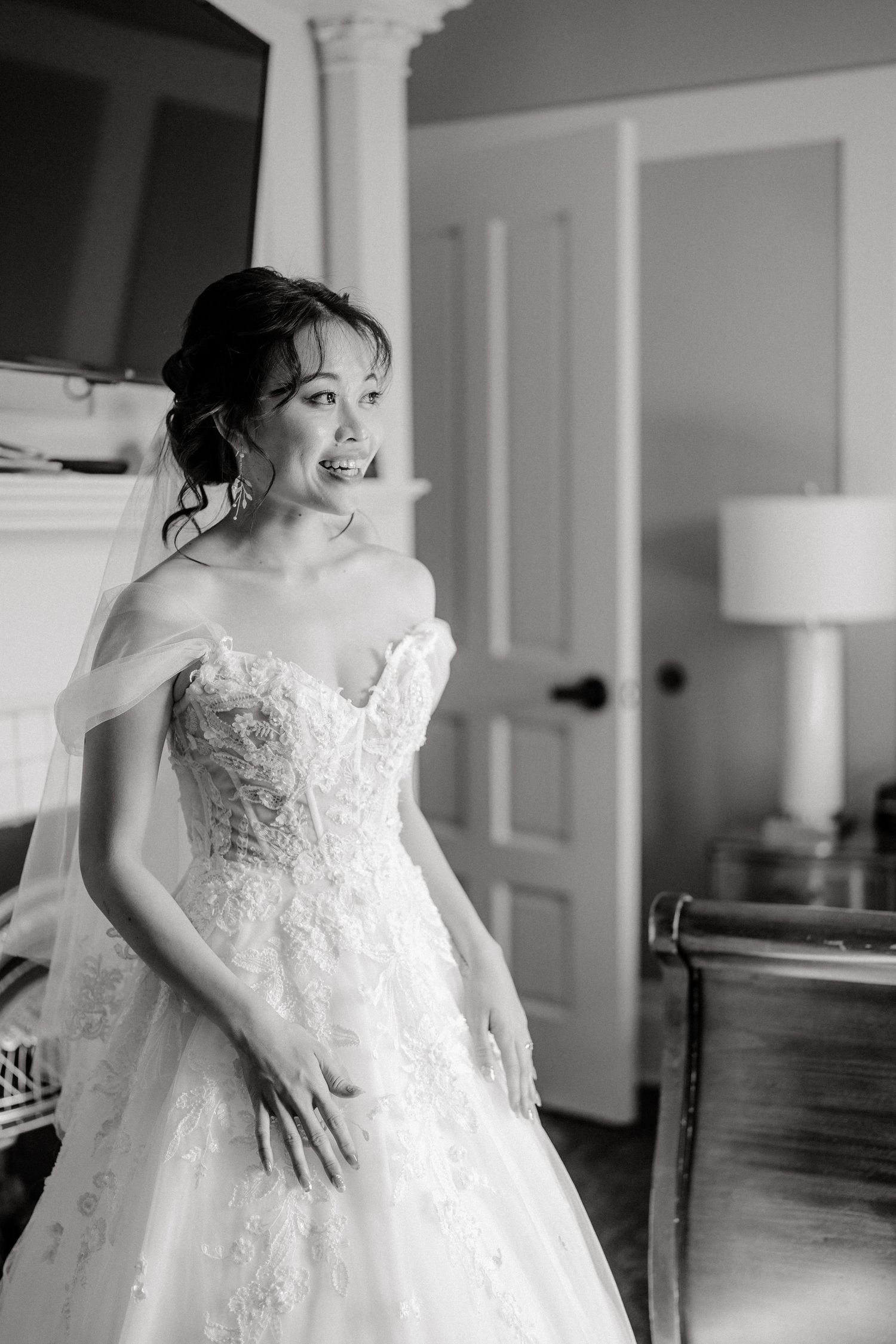 smiling bride indoor firsr-look before her pittsburgh wedding