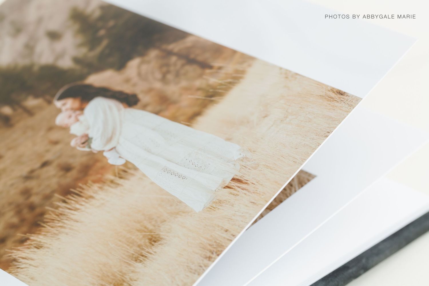 Artistic wedding photograph detail showing flowing dress in golden light.
