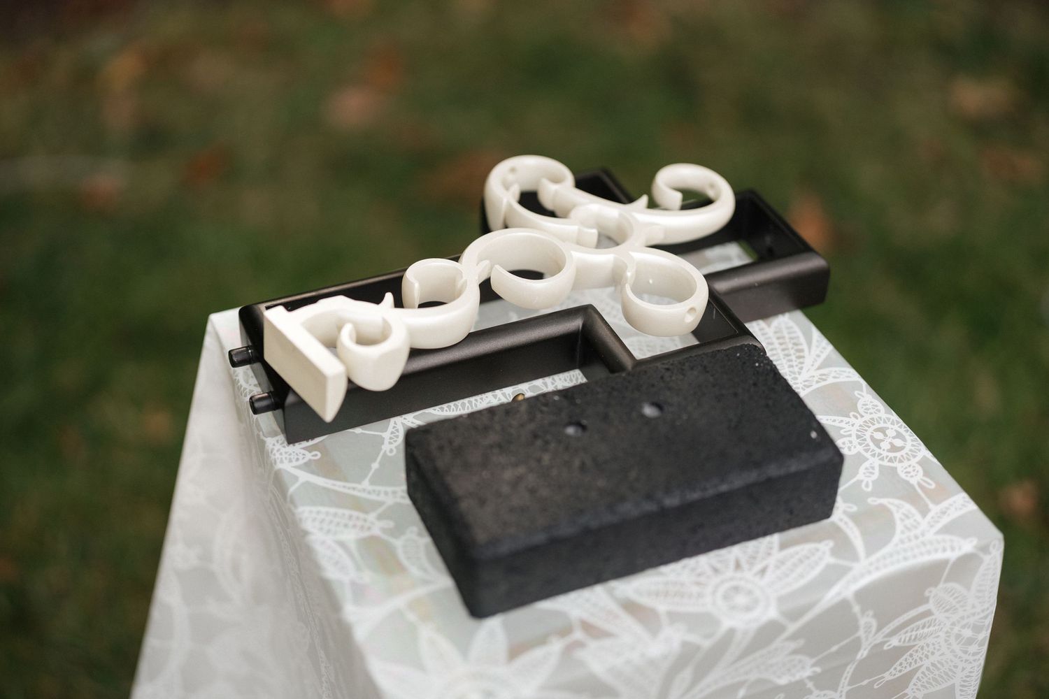 Black and white decorative boxes arranged on a white surface for a special event.