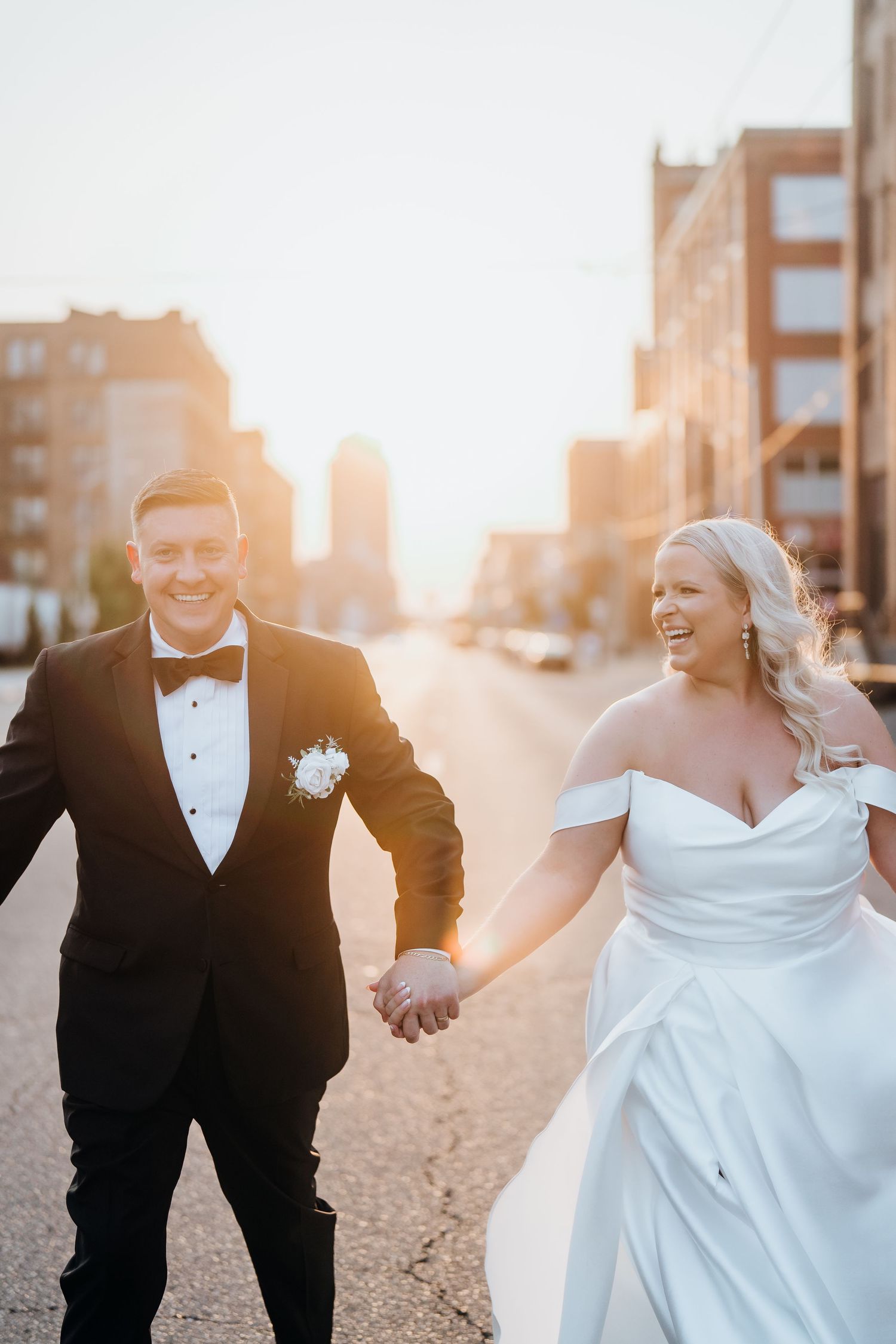 Sunset beach wedding photos with golden light illuminating the couple.