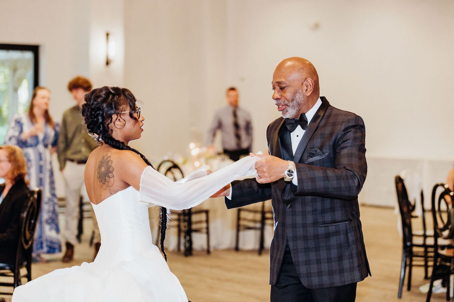 Wedding reception dance photos showing multiple couples sharing special dances in an elegant indoor venue.