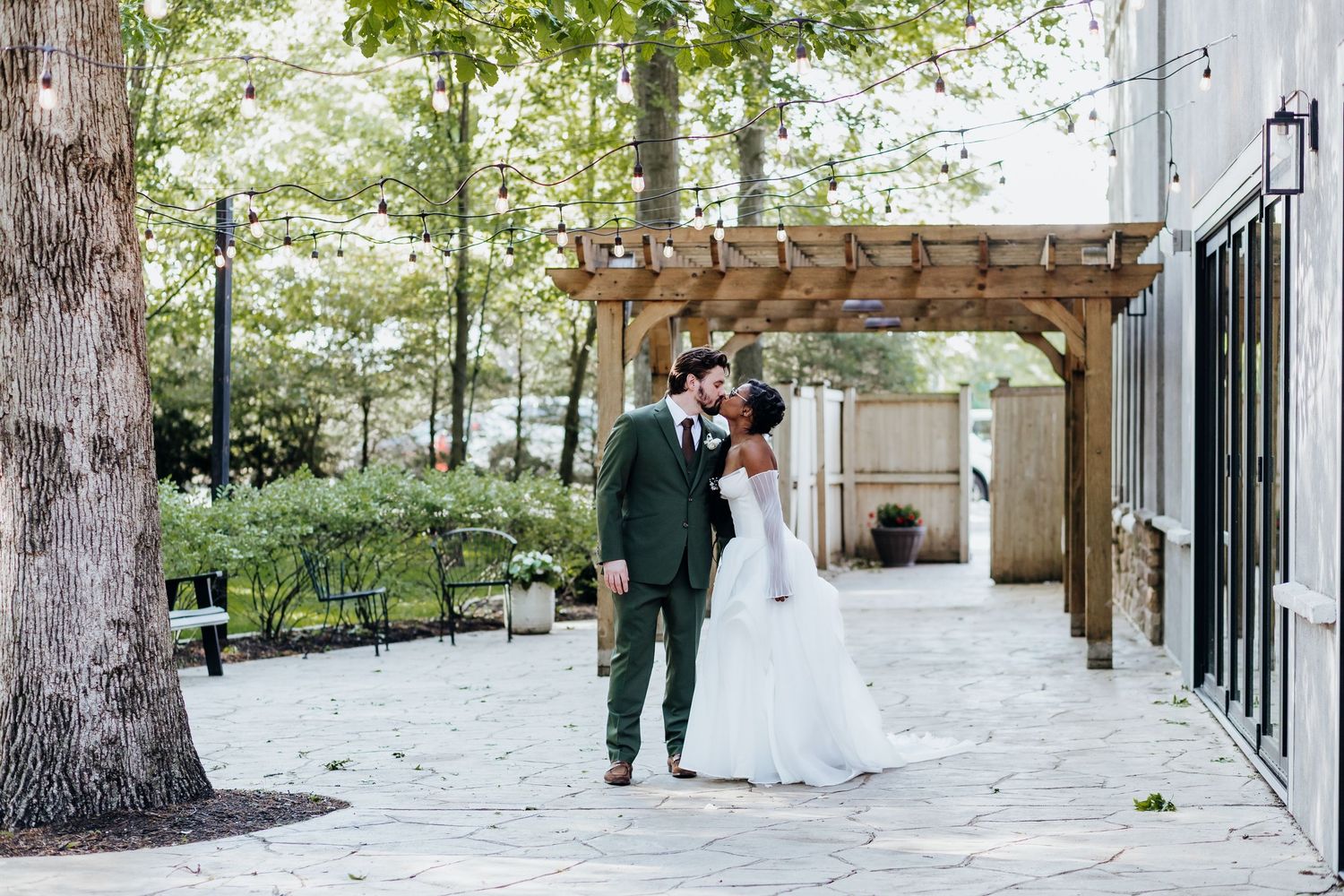 A scenic outdoor wedding venue with wooden pergolas and snow-covered ground.