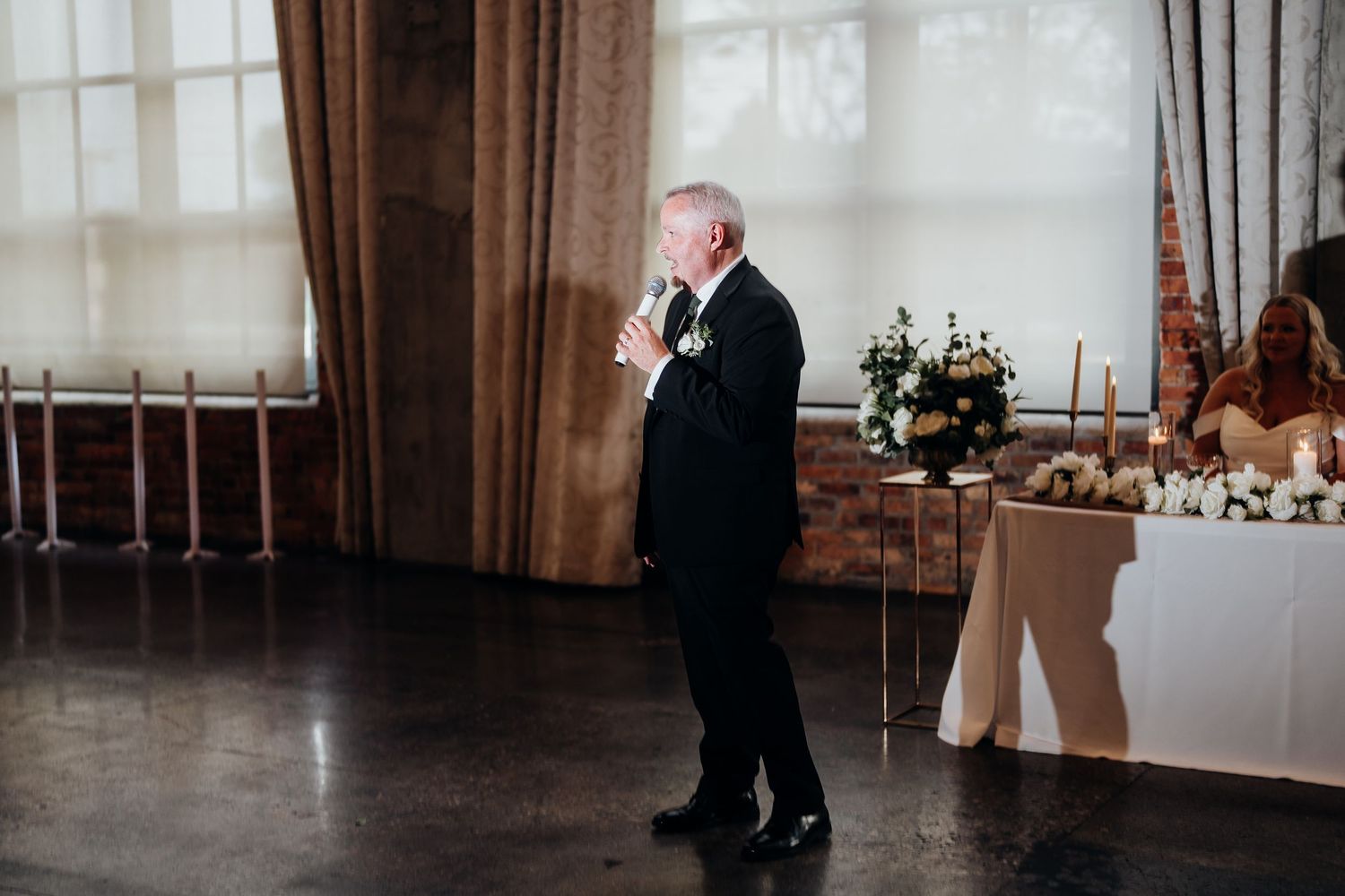 Wedding reception venue with elegant decor and natural lighting.