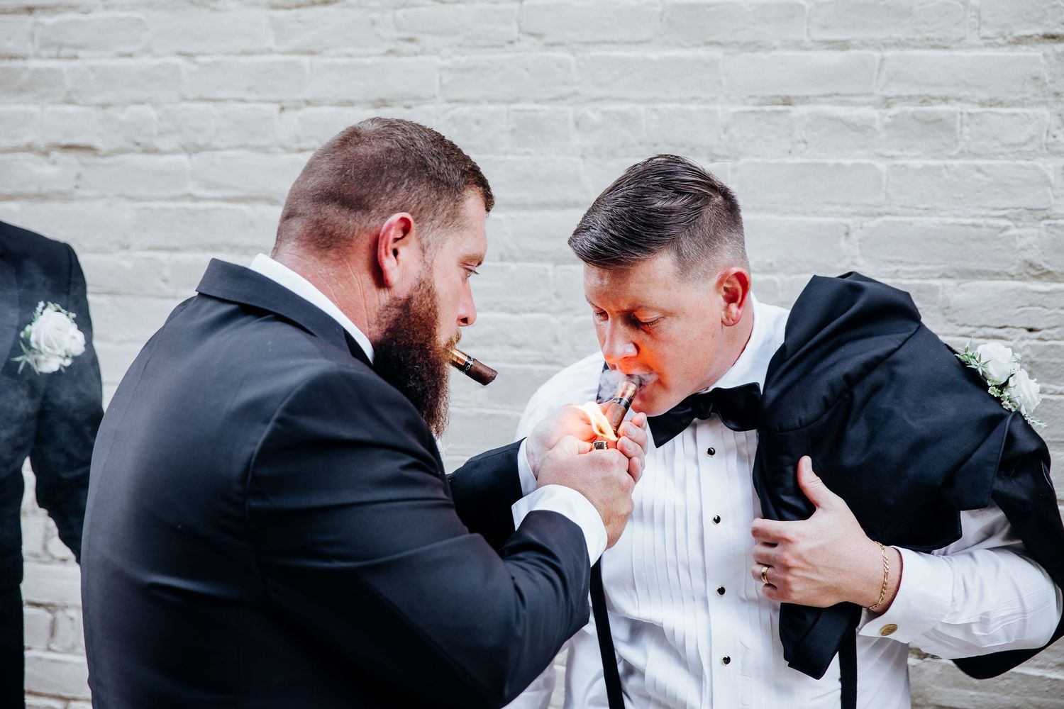 Groomsmen share laughs and emotional moments before the wedding ceremony.