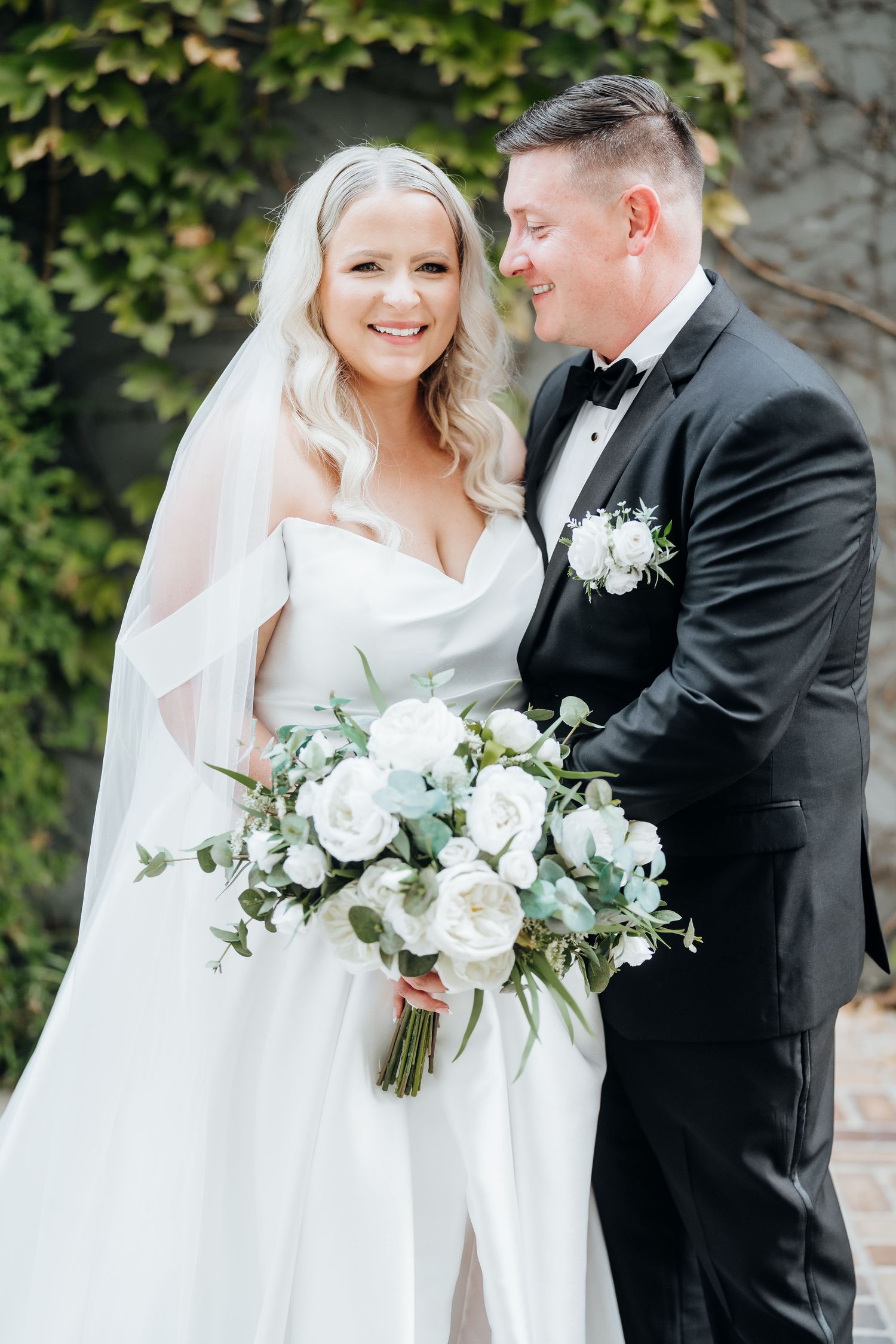 Classic wedding photography series featuring a couple in traditional white gown and black tuxedo with white floral bouquet.