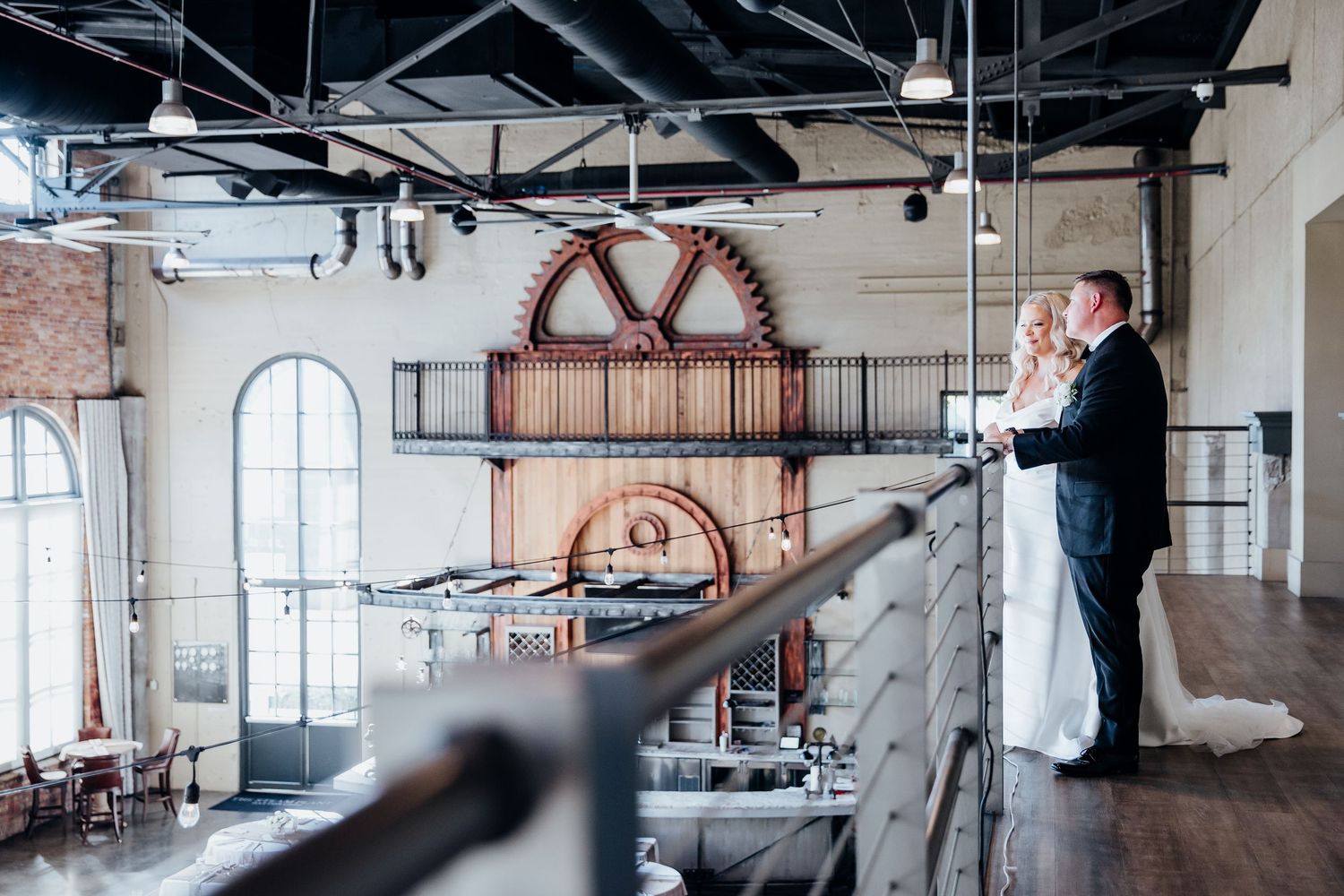Modern industrial wedding venue with exposed brick walls and high ceilings.