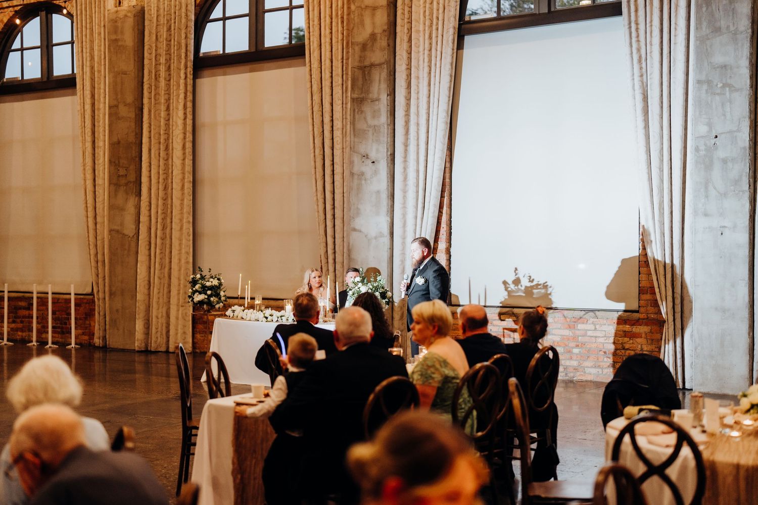 Interior view of an elegant wedding ceremony venue with high ceilings and ornate architecture.