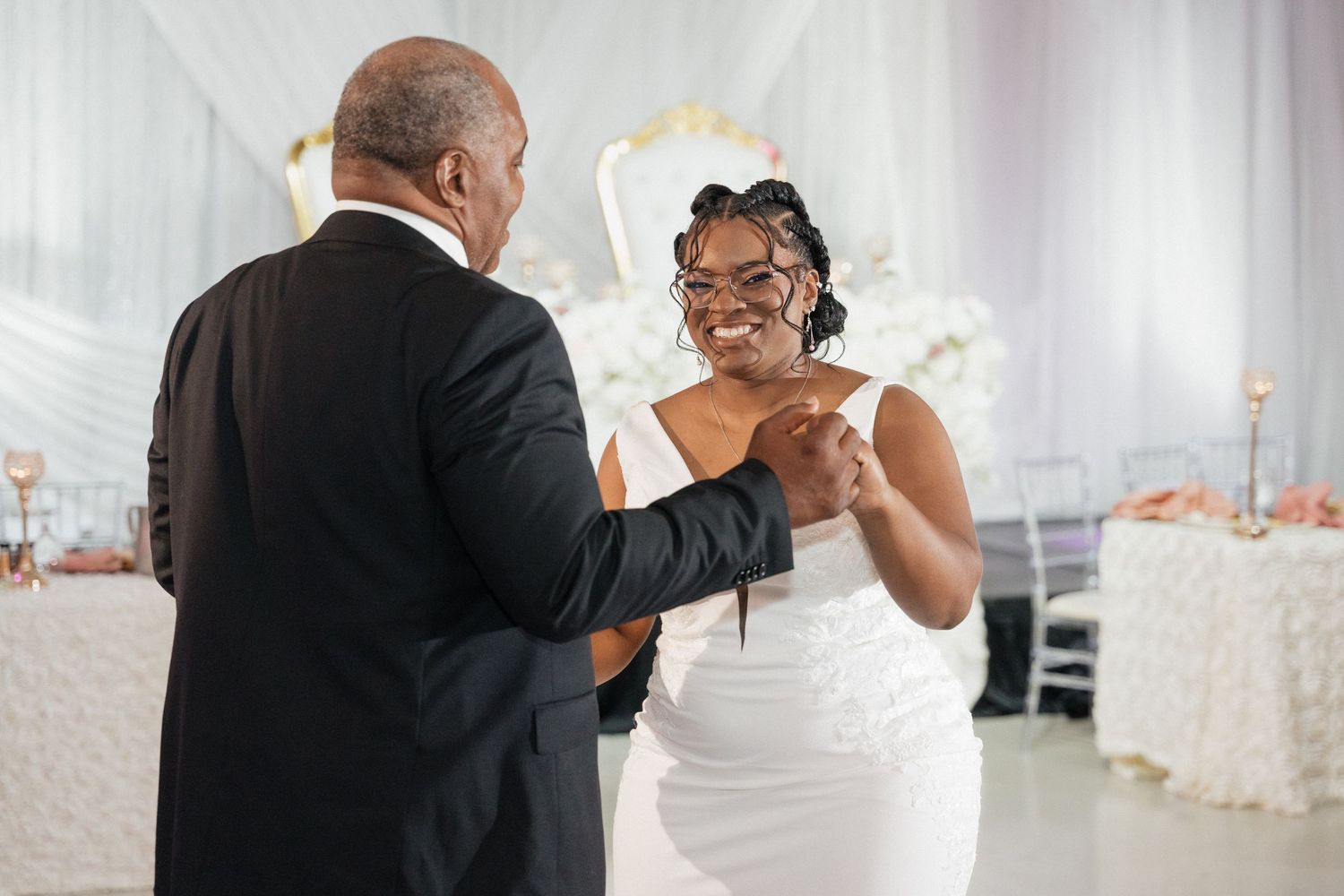 Wedding reception candid moments captured during dancing and celebrations.
