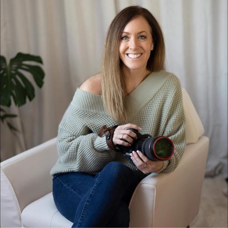 A candid lifestyle series showing someone in blue jeans and a sage green sweater sitting comfortably on a beige armchair.