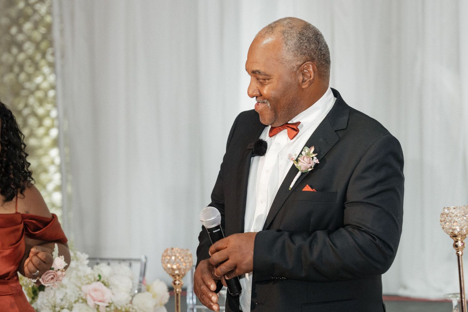 Wedding reception speeches and toasts captured in candid moments.