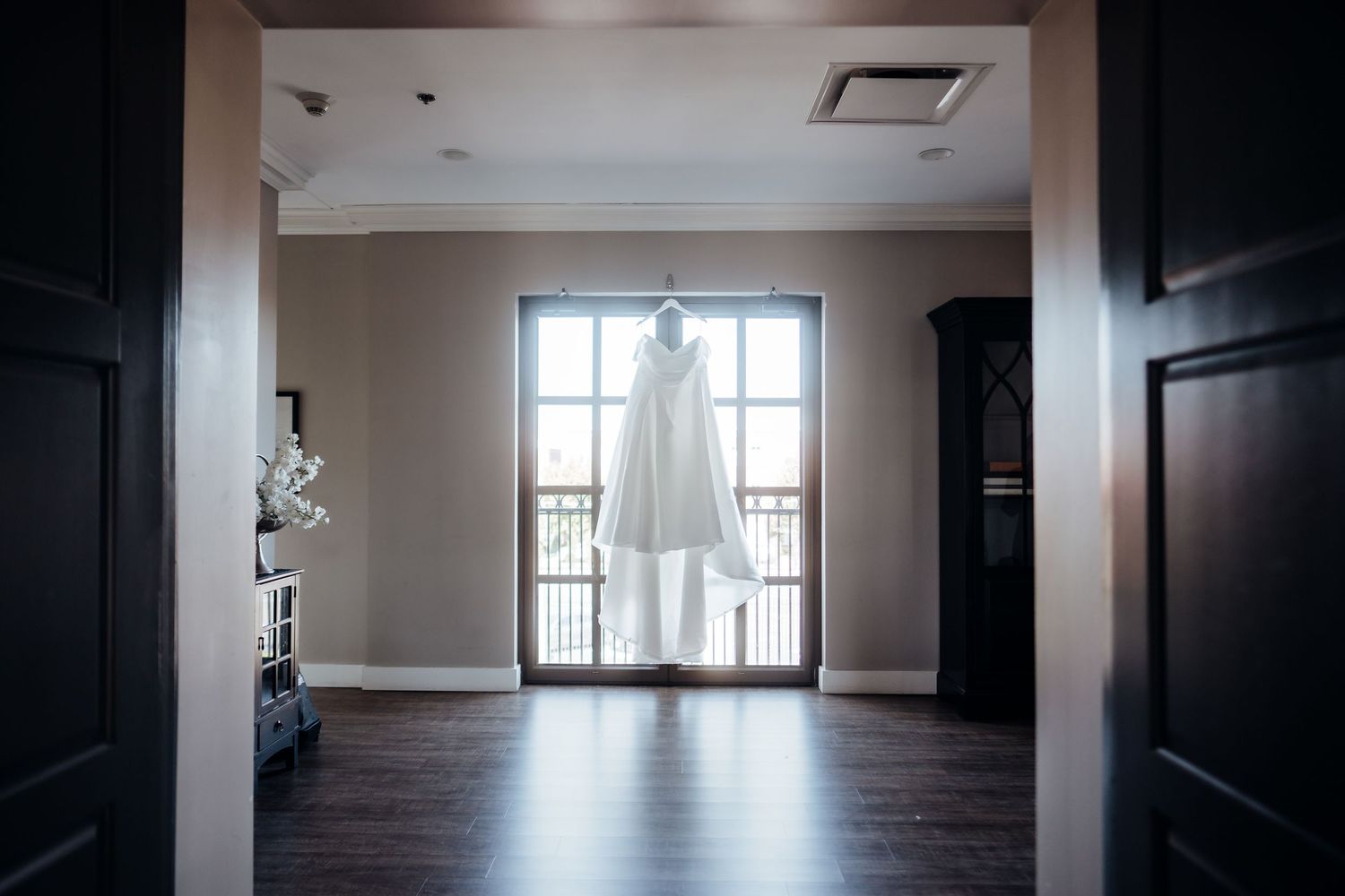 Empty modern event space with large windows and natural lighting.
