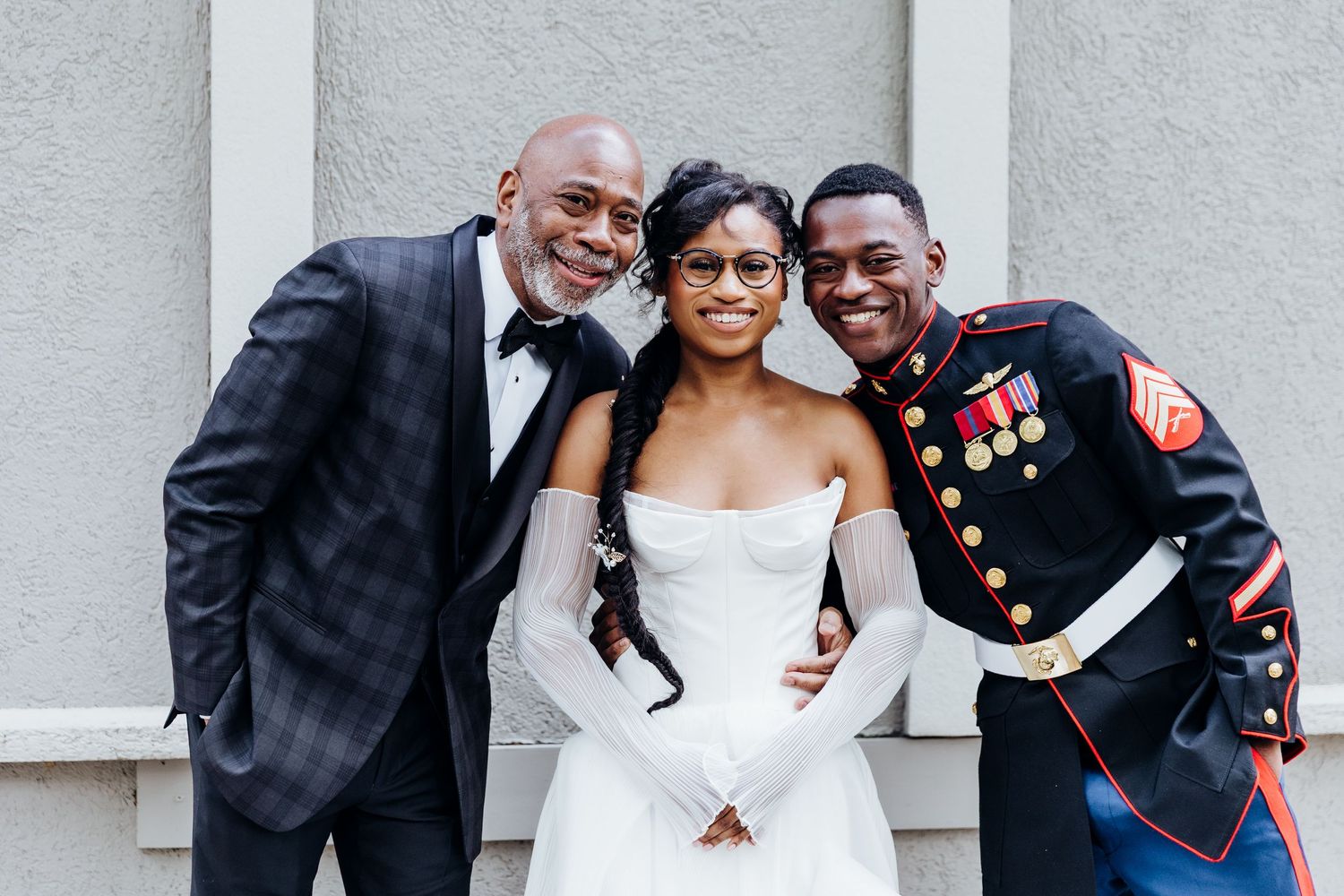Wedding ceremony with a bride in white dress and military groom in formal uniform.