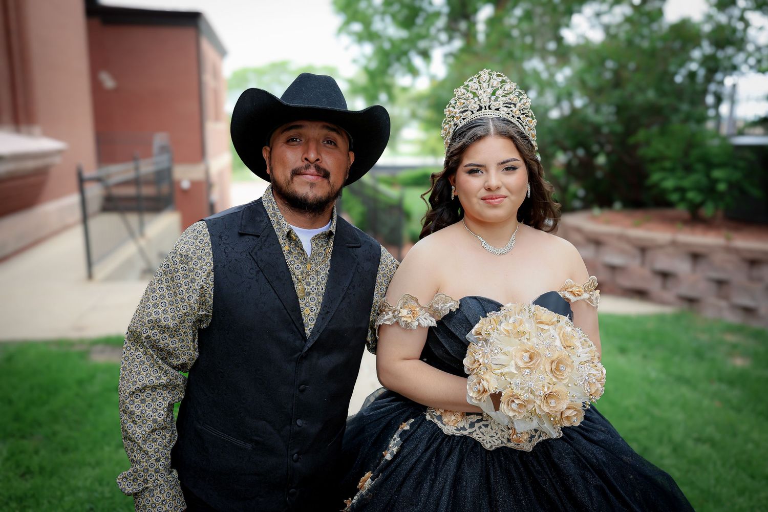 Formal portraits taken outdoors with black dress and cowboy attire.