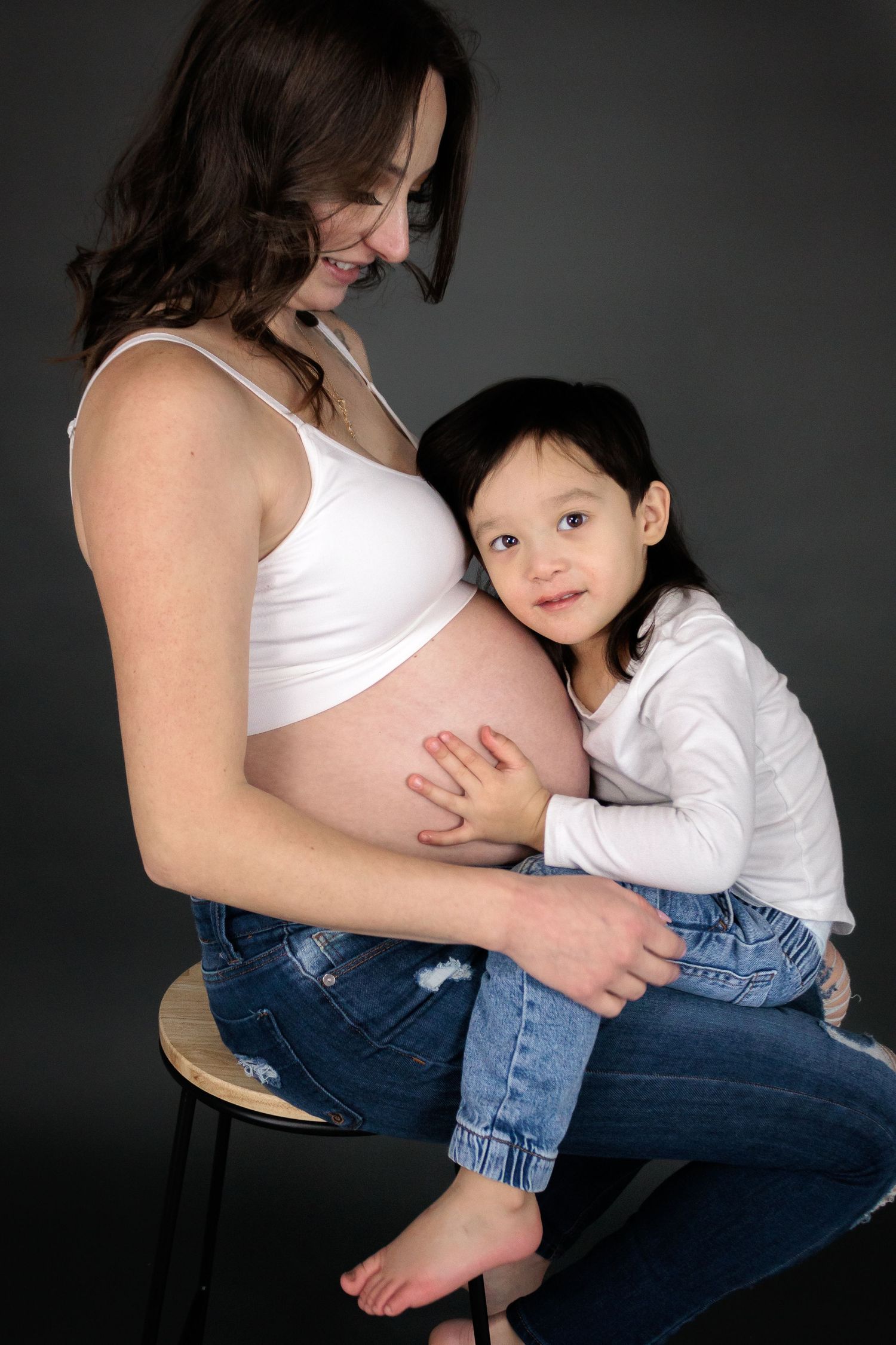 Maternity photo sequence showing tender moments between pregnant woman and young child.