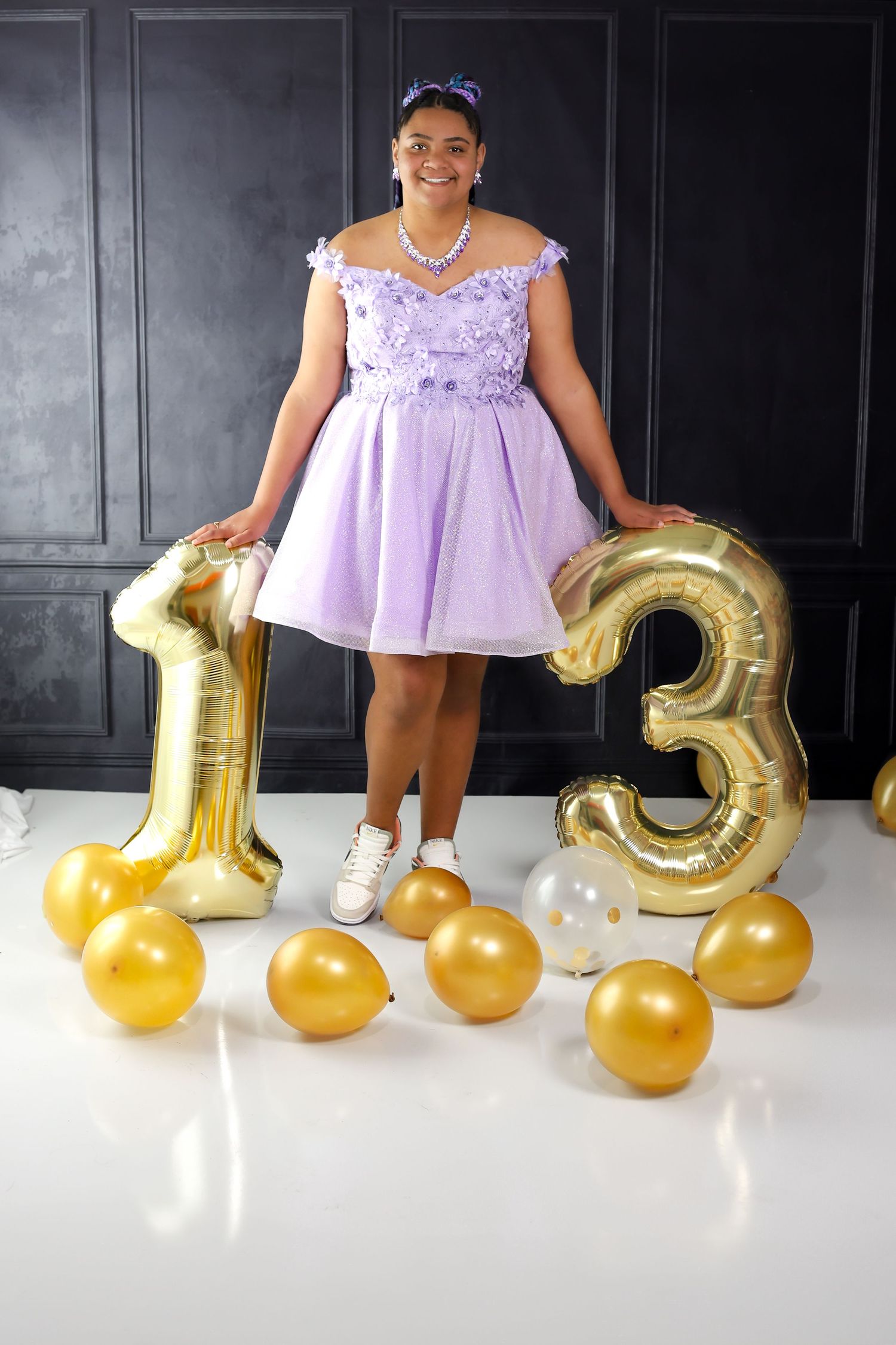 A series of photos showing someone in a lavender dress posing with gold number balloons and decorations.