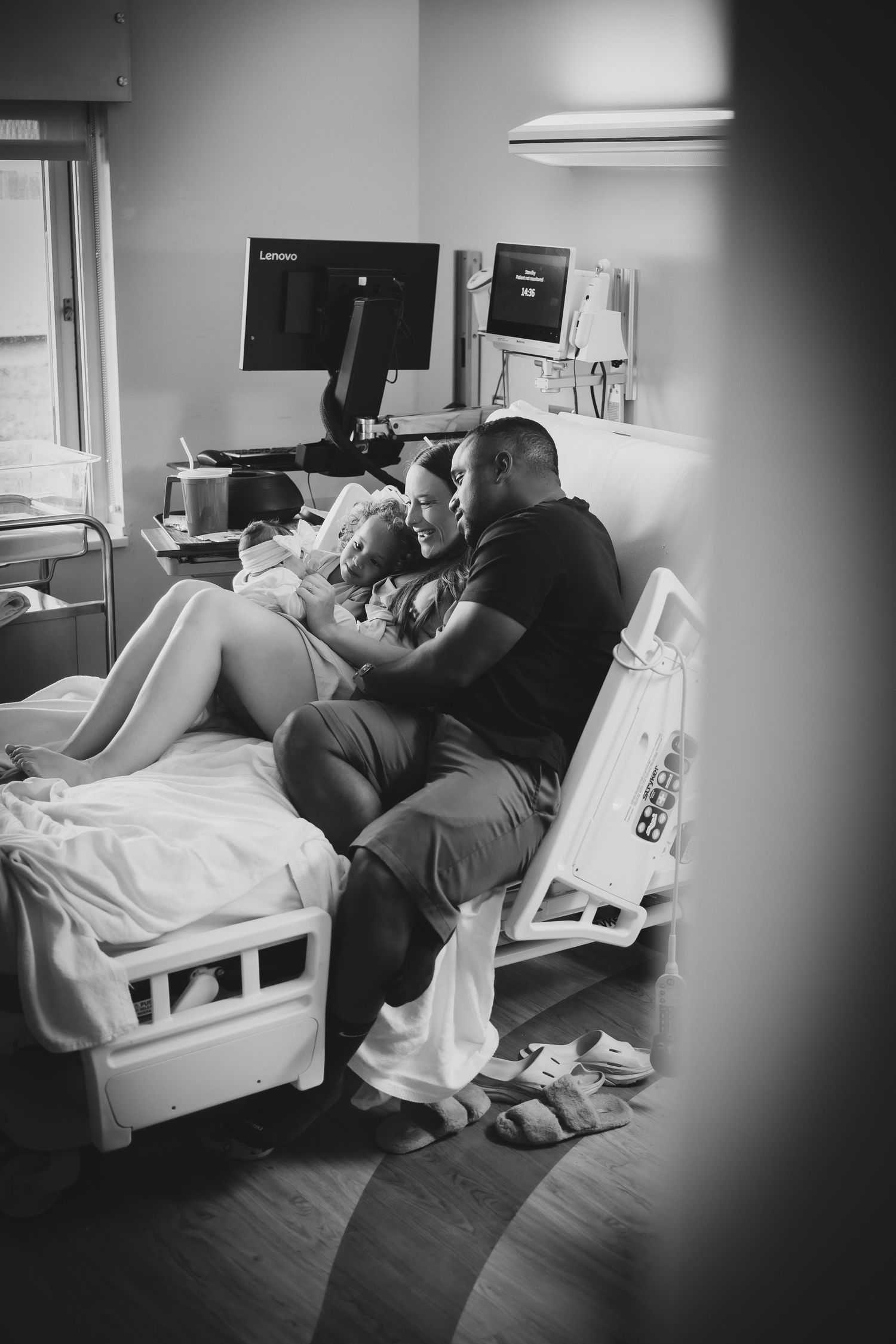 A series of black and white hospital room photos showing someone resting in a medical bed during labor and delivery.