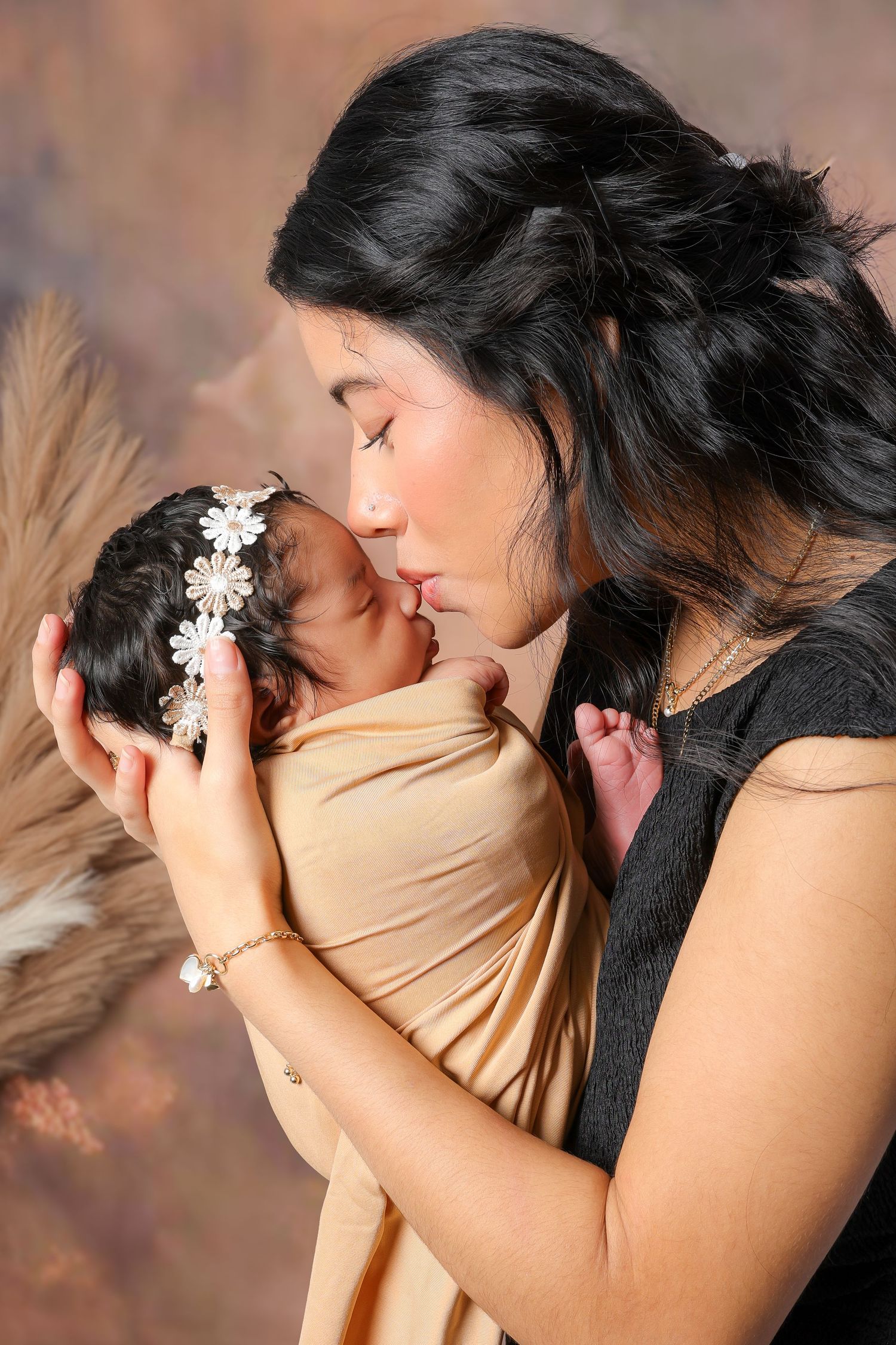 A series of intimate romantic photos showing a couple embracing in warm lighting against a brown background.