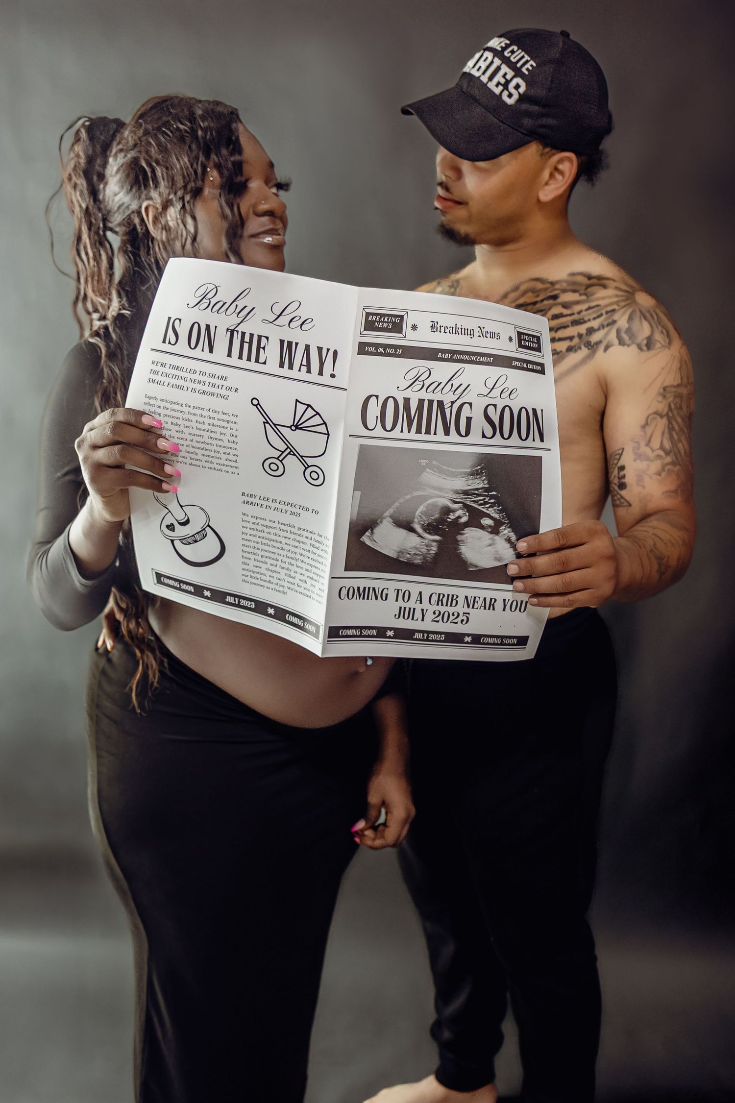 Creative pregnancy reveal photos with couple holding newspaper announcement in moody lighting.