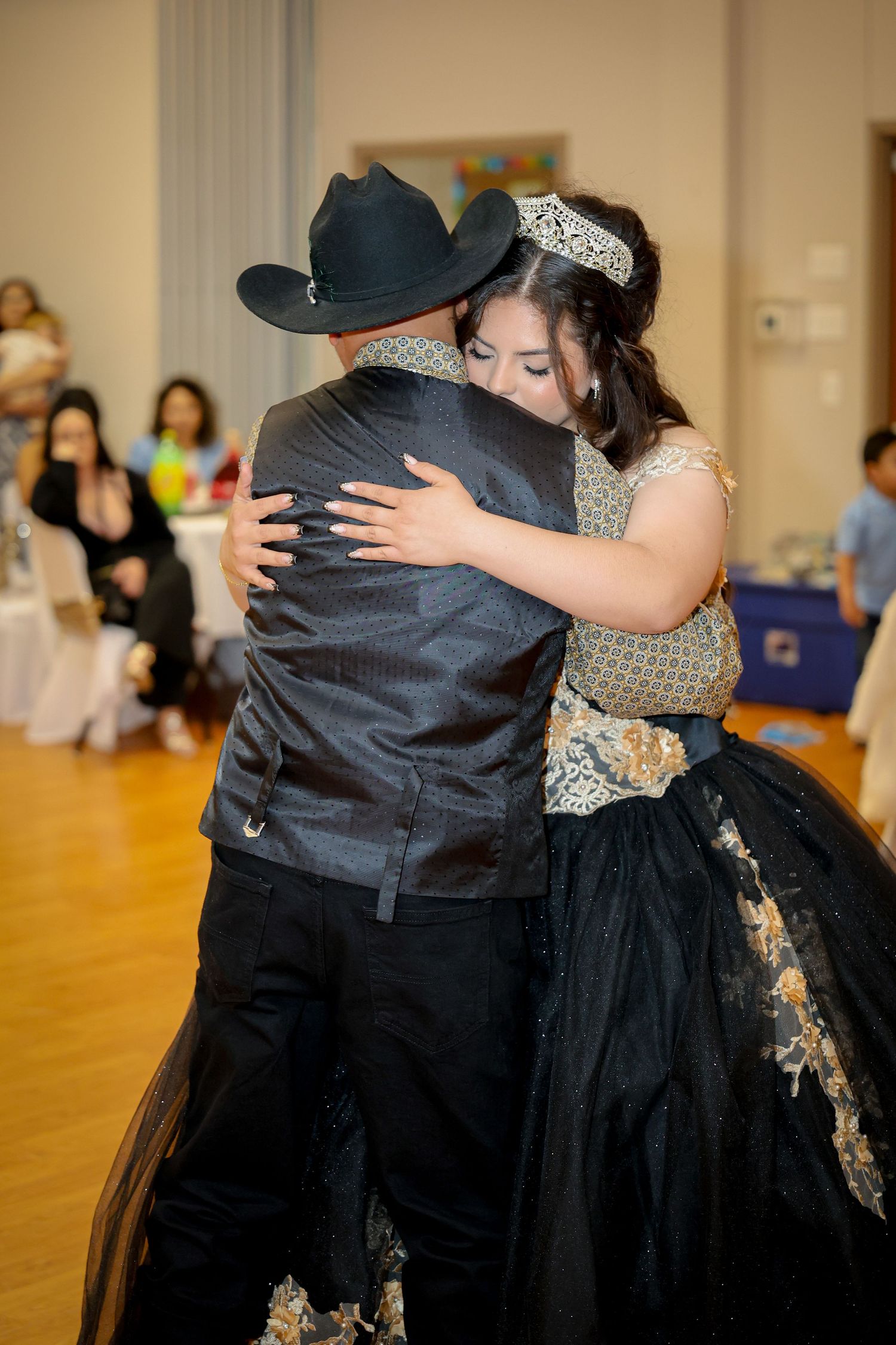 Dance sequence showing couples embracing in a ballroom setting.