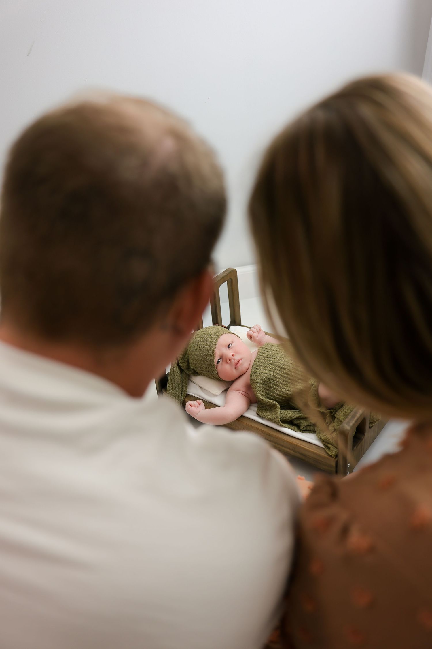 A series of blurred profile shots showing two people leaning in close together in a soft, intimate moment.