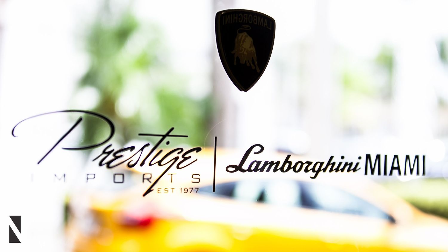 The logo for Prestige Imports Lamborghini Miami dealership shown in an elegant script font.