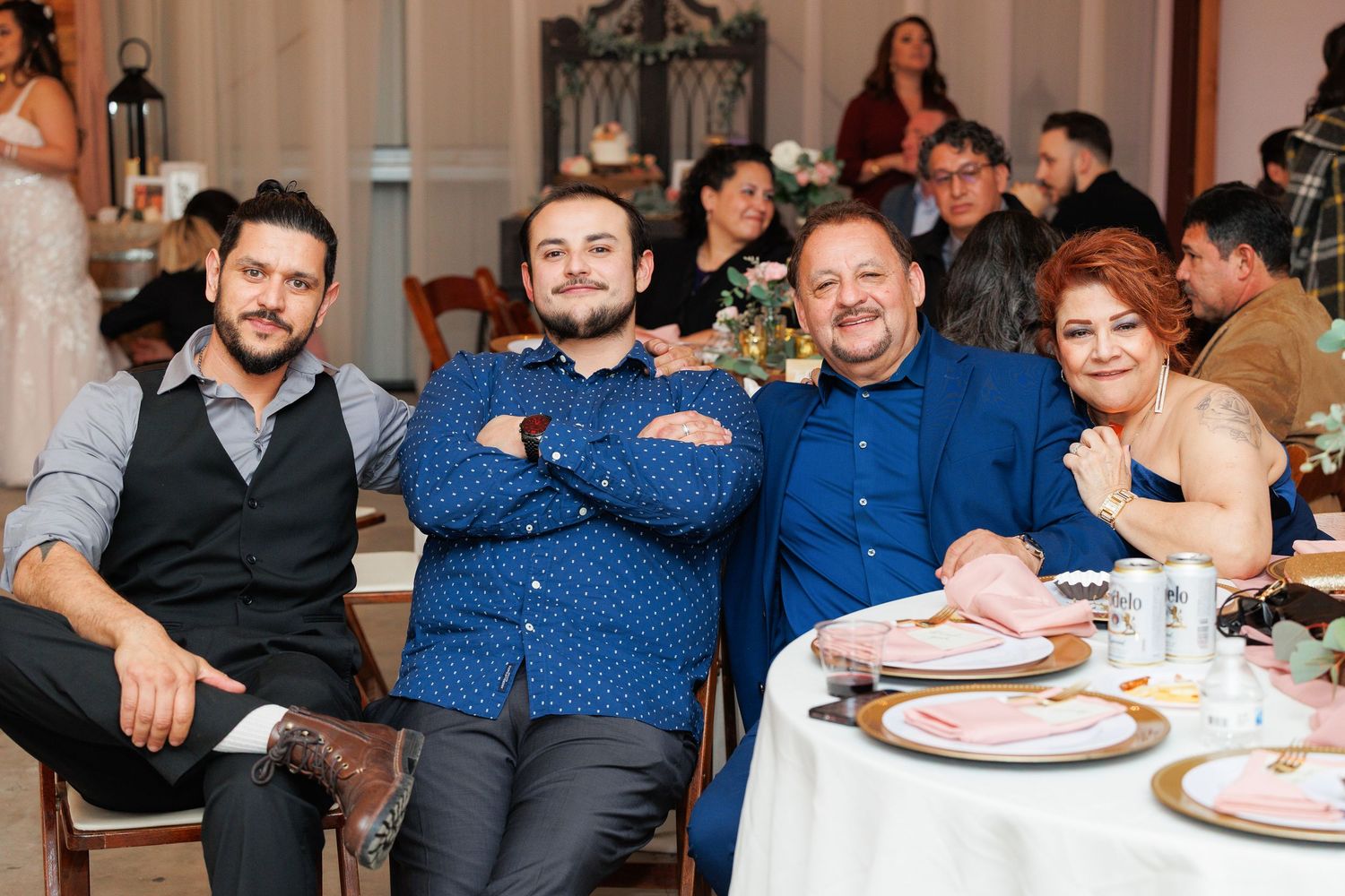 People enjoying a celebration at a formal dining event with multiple guests seated at tables.