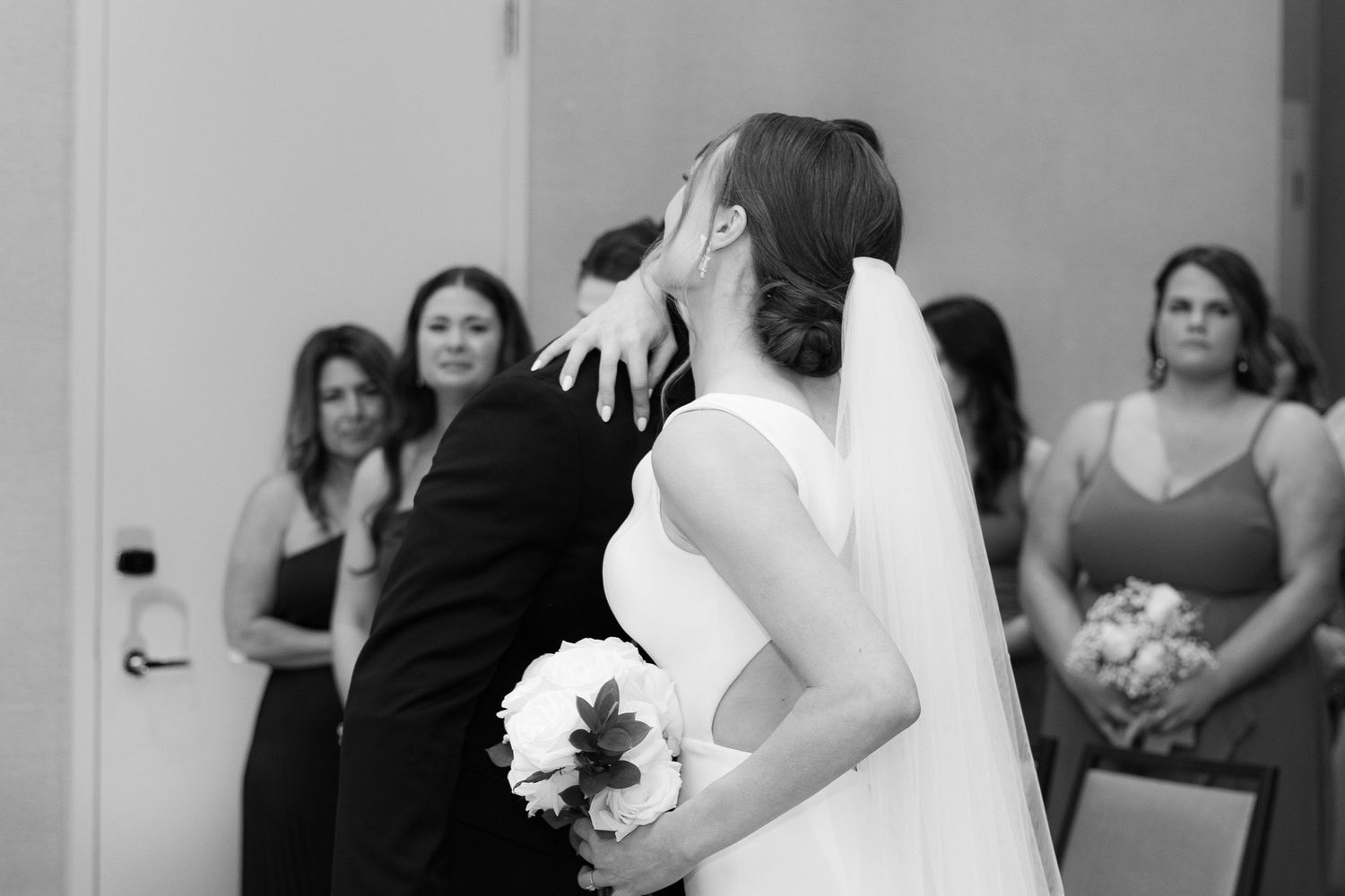 A series of black and white wedding photographs showing candid moments and preparations during a celebration.