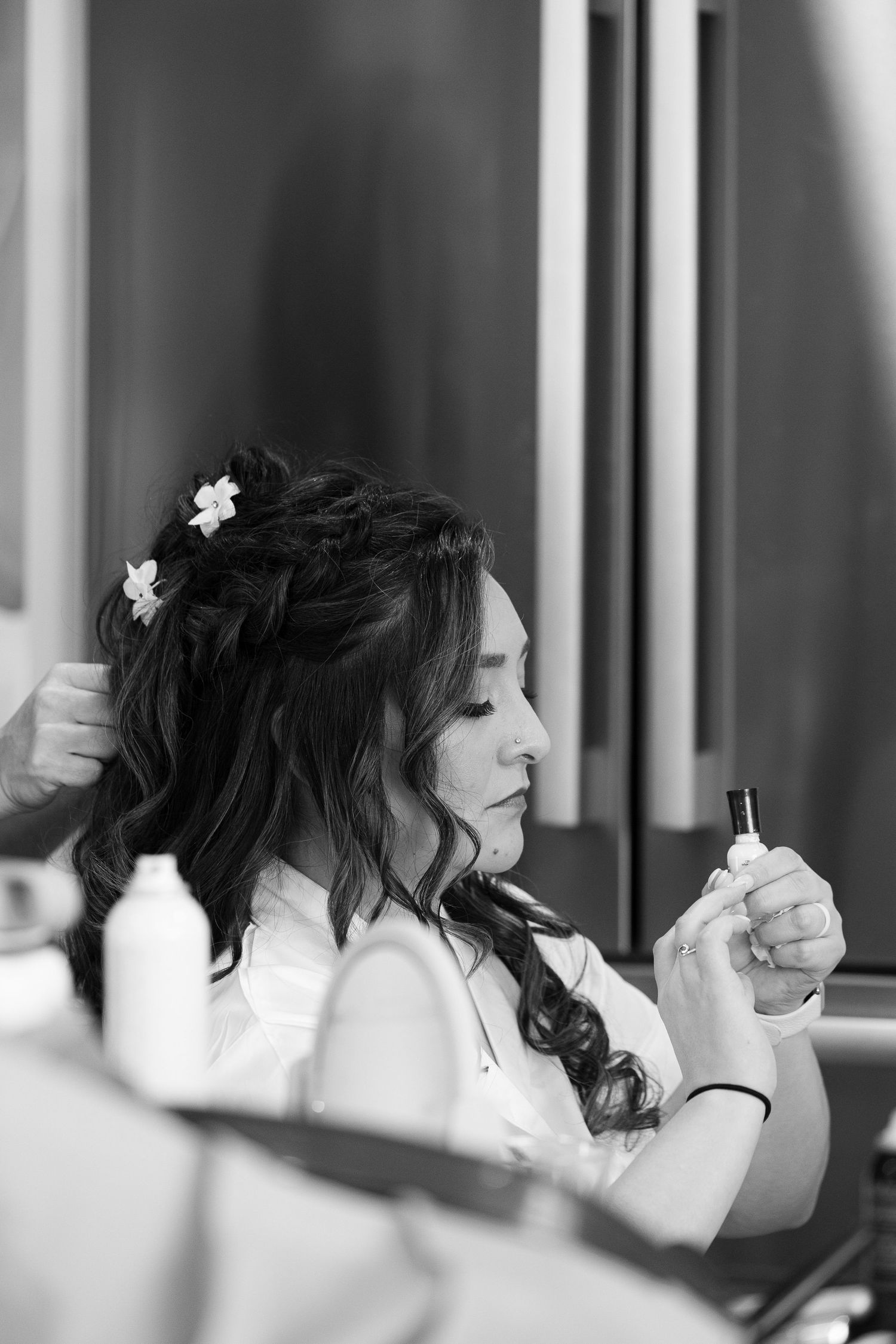 A black and white photo sequence shows a woman in white with flowers in her dark hair looking to the side.