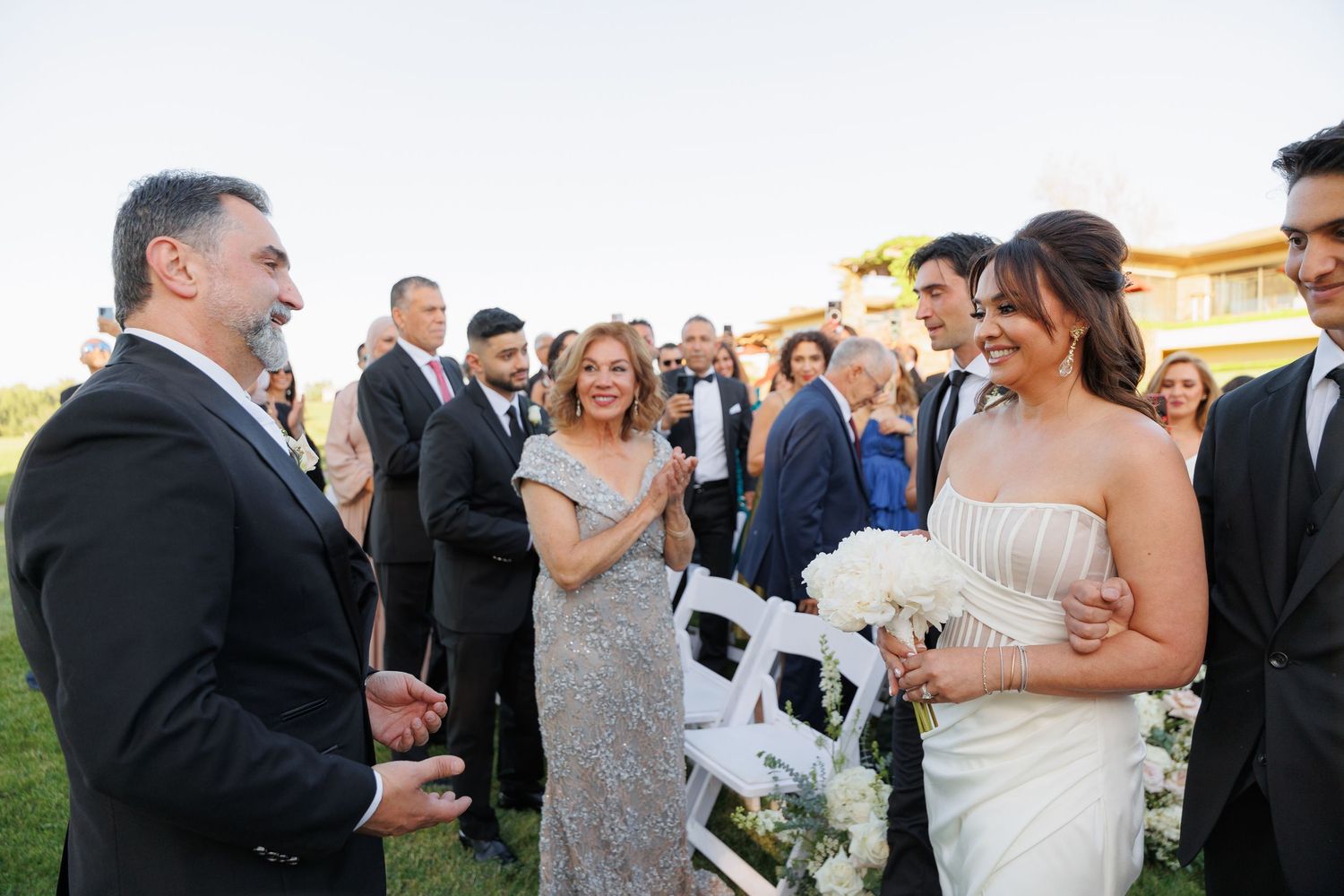 Candid moments from an outdoor wedding reception show guests mingling and celebrating on a sunny day.