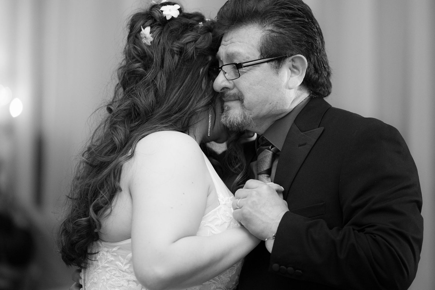 A black and white photo collage showing intimate romantic moments between a couple.