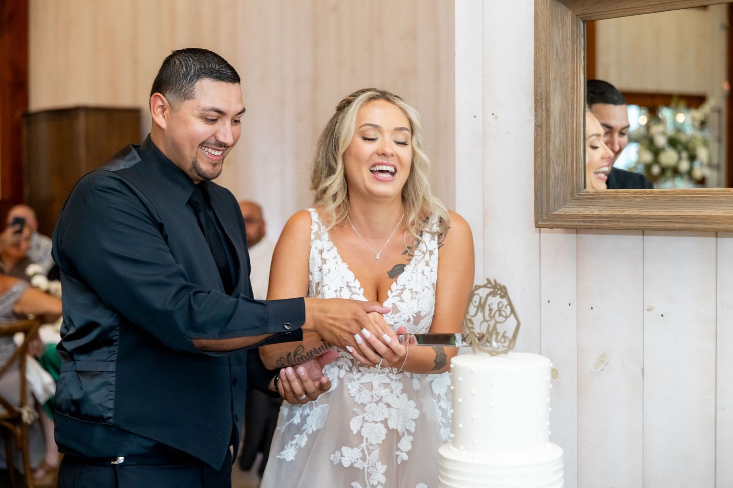 Wedding reception candid moments showing laughter and joy during celebrations.