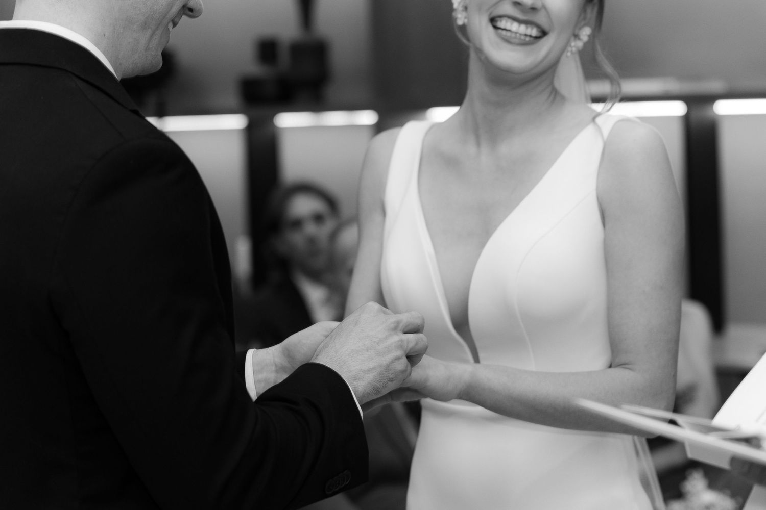 A collection of black and white photos showing a person in a sleeveless white dress in various candid poses.