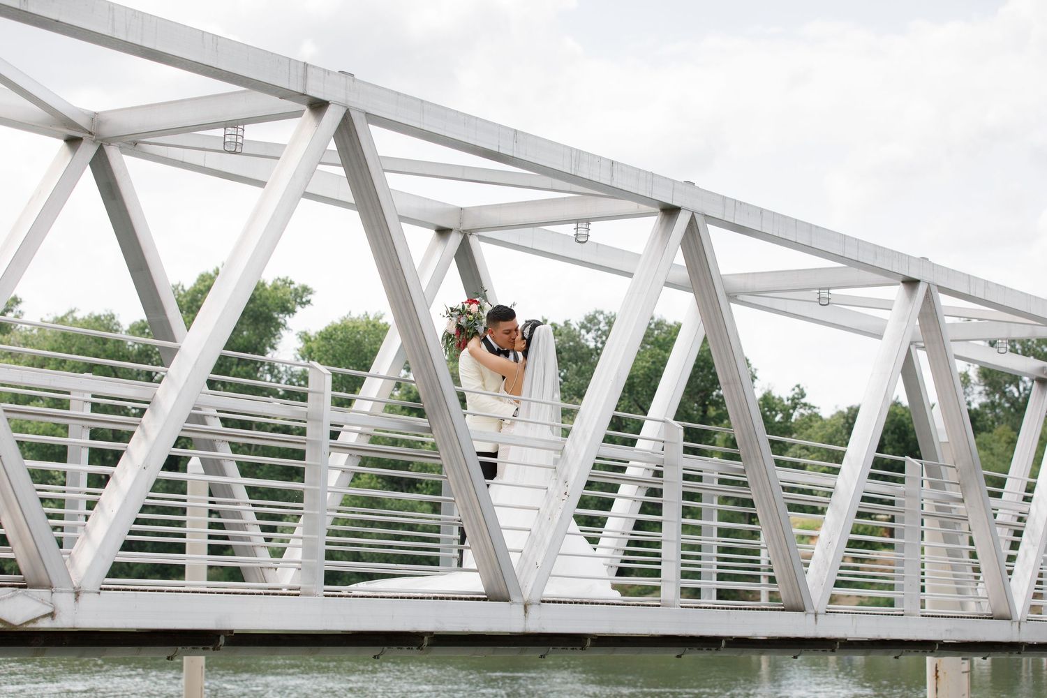 A series of four photos showing a white metal bridge structure with architectural details and angles.