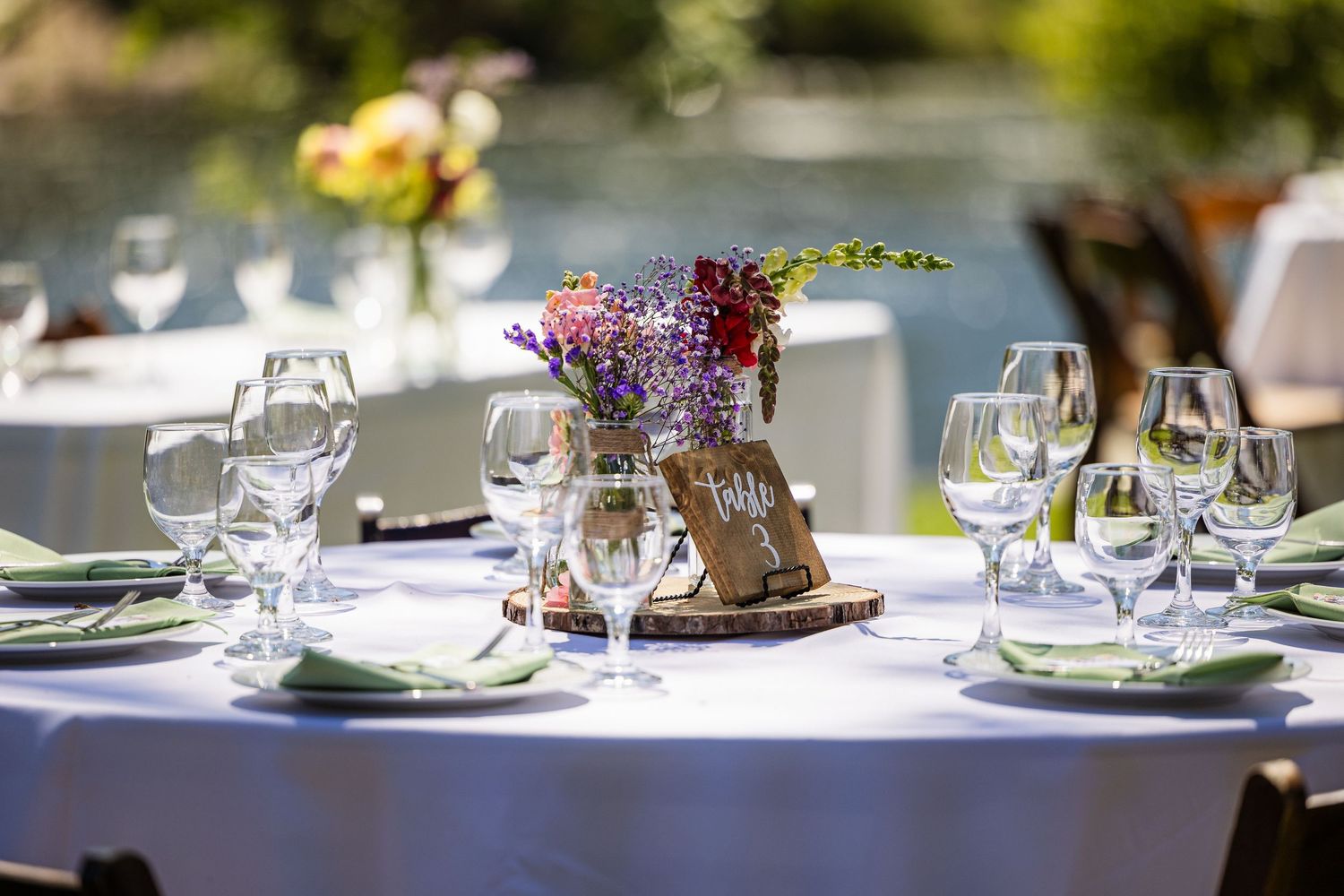 Elegant table settings with wine glasses and place settings arranged for a formal dining event.