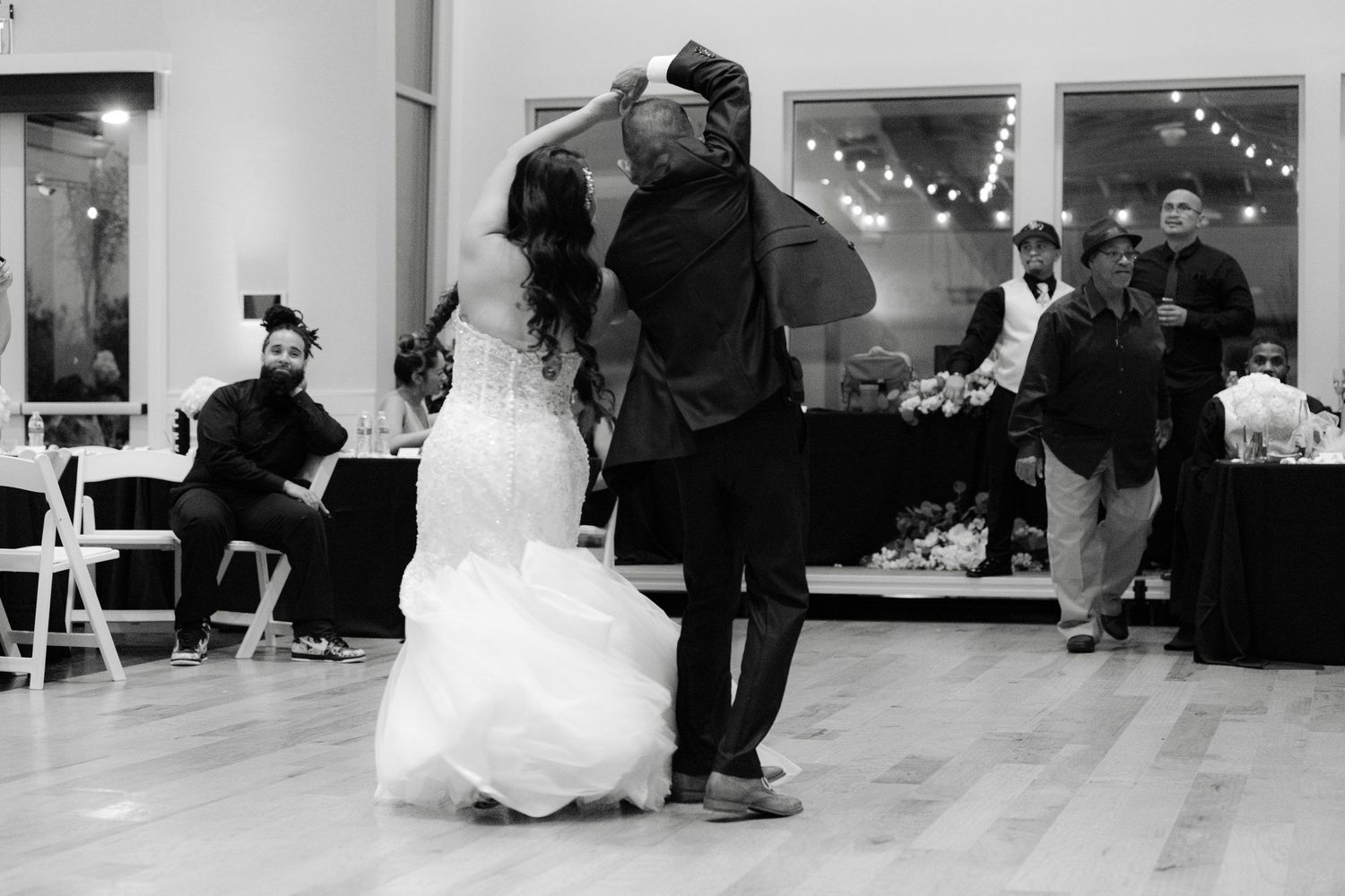 Black and white photo sequence showing a couple dancing and dipping during a romantic ballroom dance performance.