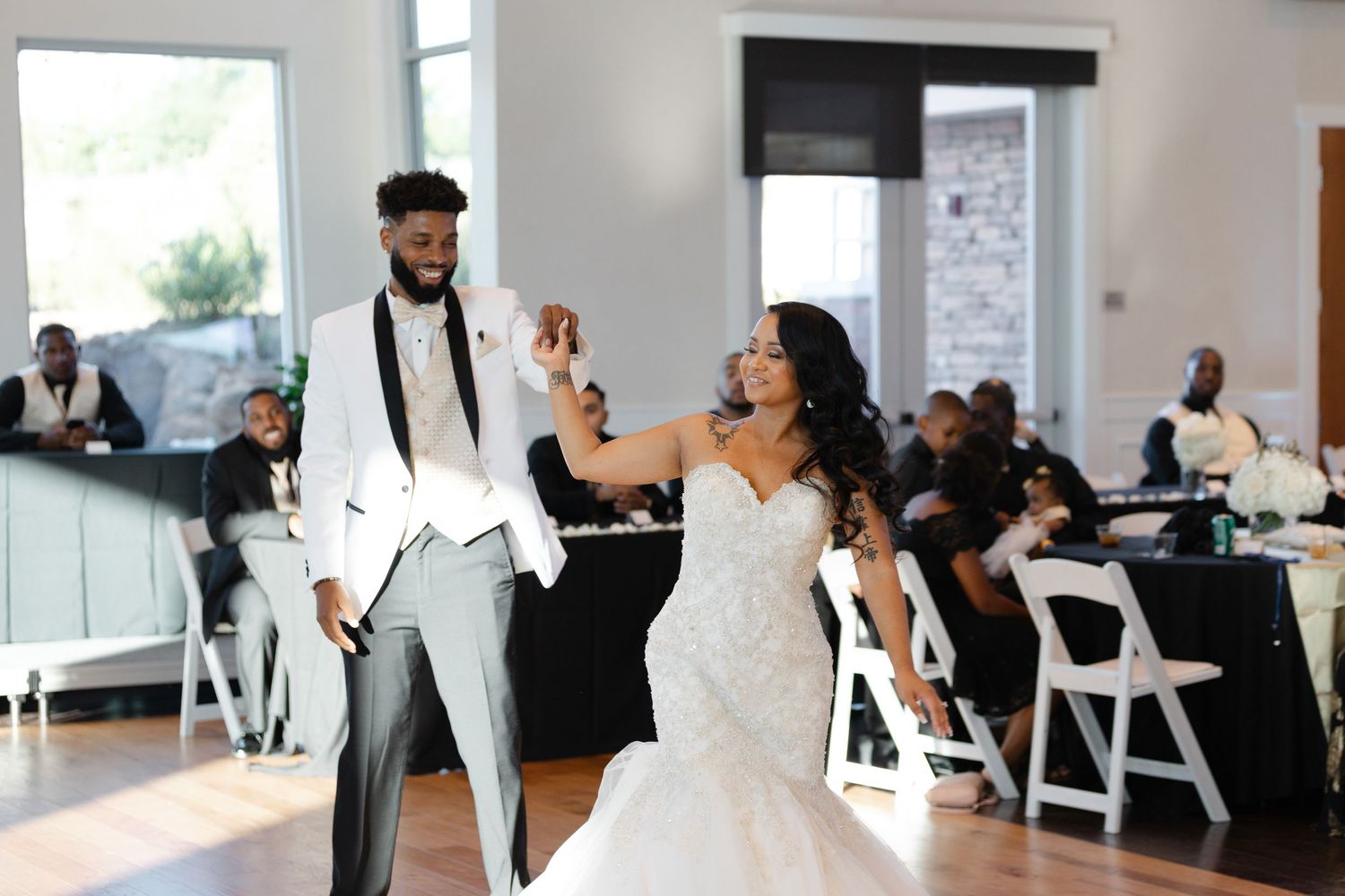 A collection of candid wedding reception moments showing dancing and celebration in a bright indoor venue.