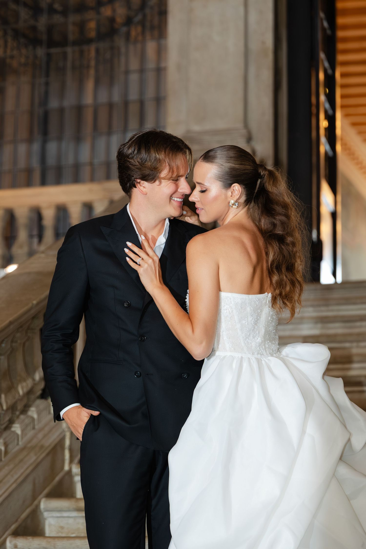 A romantic sequence of wedding photos showing a couple sharing tender kisses on elegant marble steps.