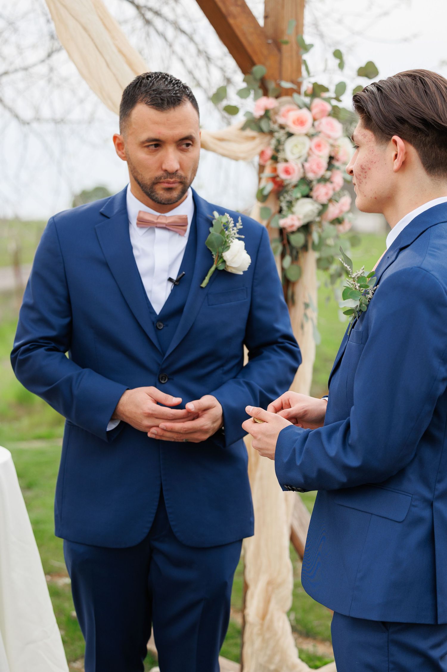 Sequence of photos showing a wedding couple exchanging rings during an outdoor ceremony with floral decorations.