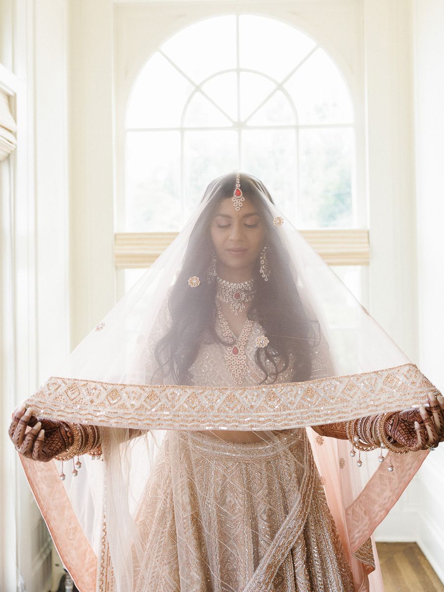 A series of ethereal bridal portraits showing a delicate veil being held in soft natural window light.
