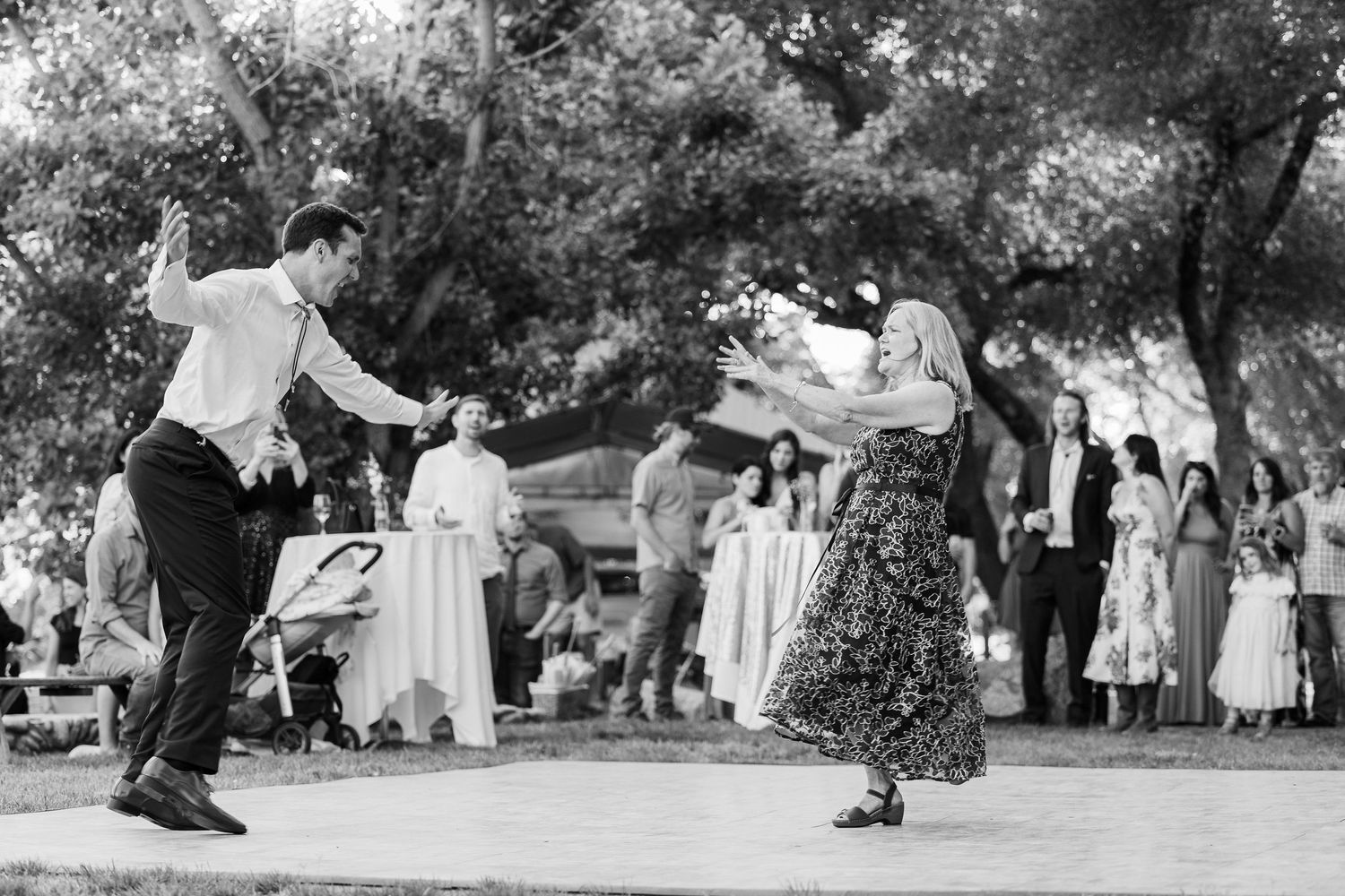 A series of vintage black and white photographs showing people dancing outdoors in traditional folk dance movements.