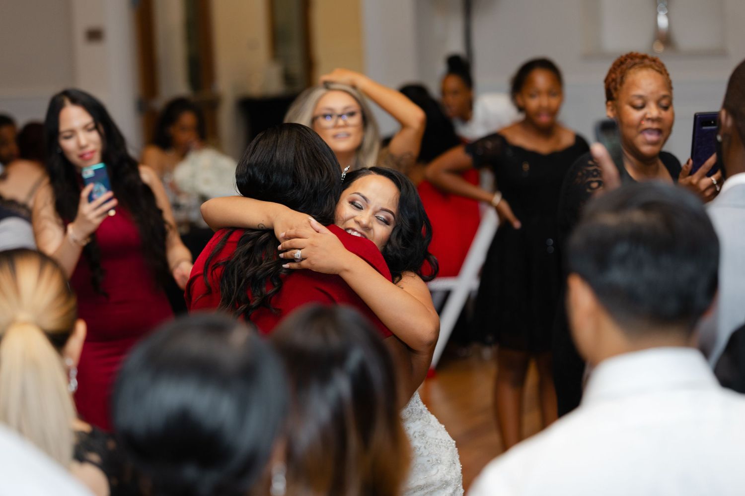 A lively dance party with people celebrating and having fun on a crowded dance floor.